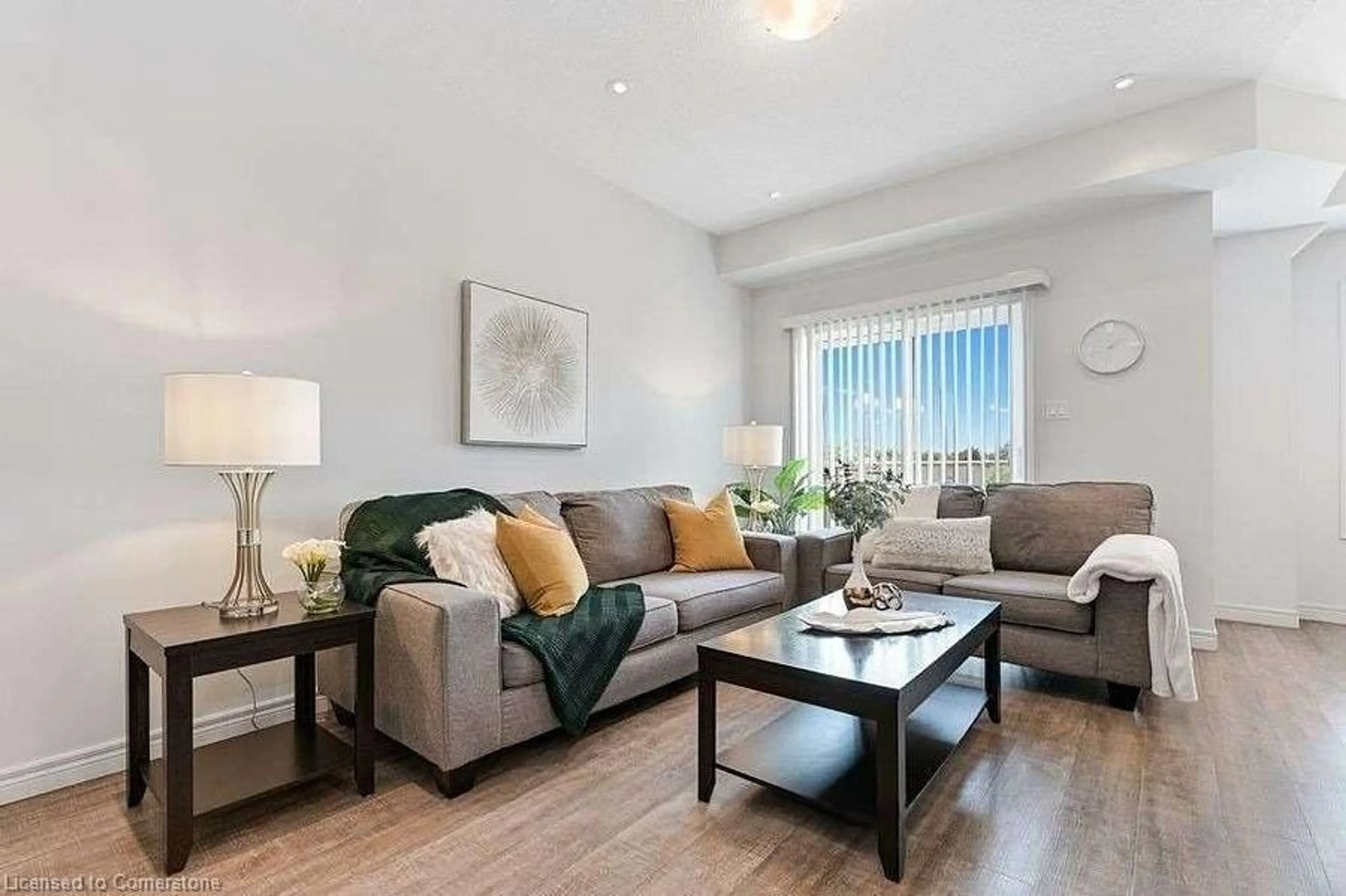 Living room with furniture, wood/laminate floor for 88 Westbank Trail, Stoney Creek Ontario L8J 0H5