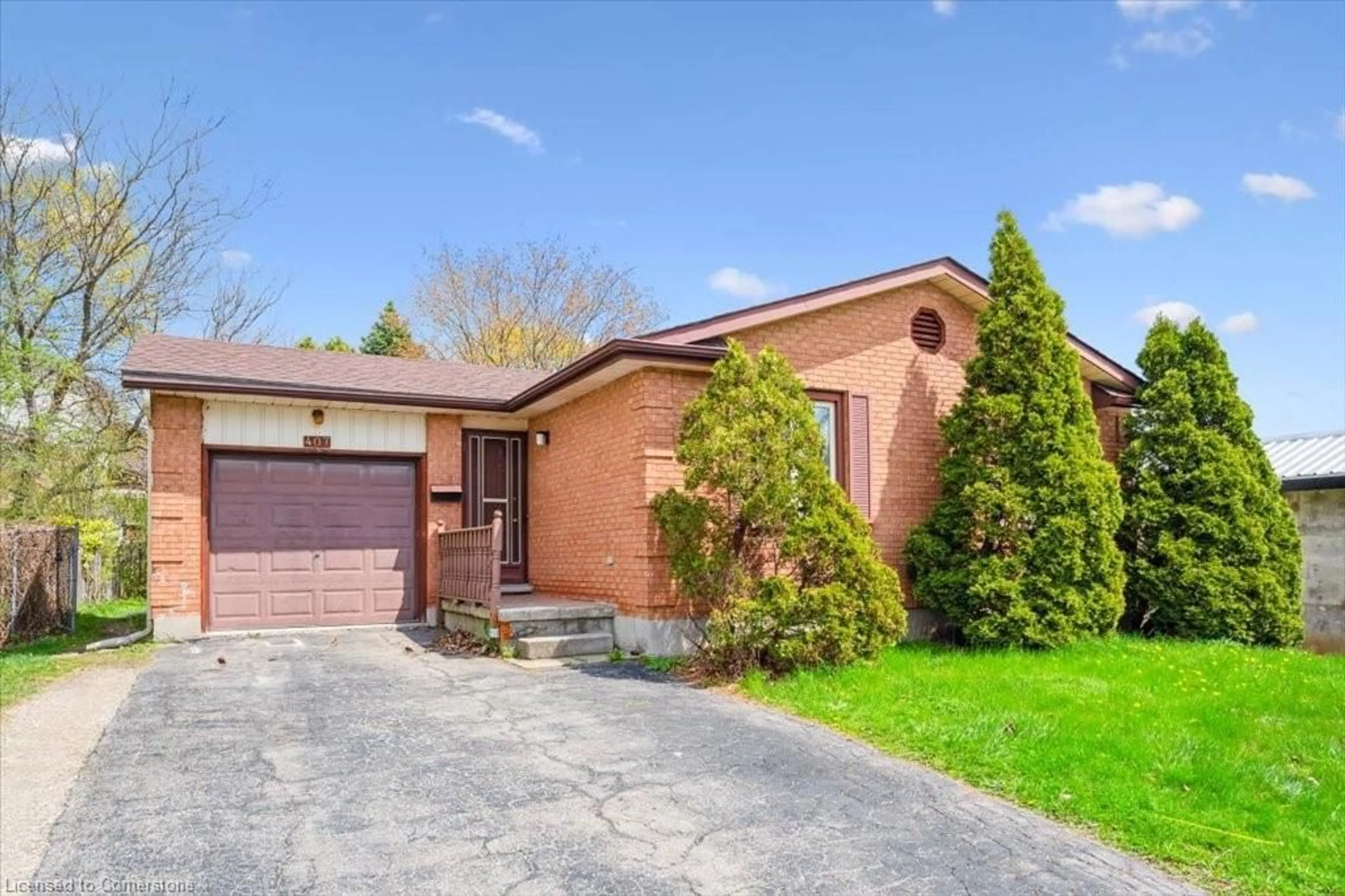 Home with brick exterior material, street for 407 Ironwood Rd, Guelph Ontario N1G 3R2