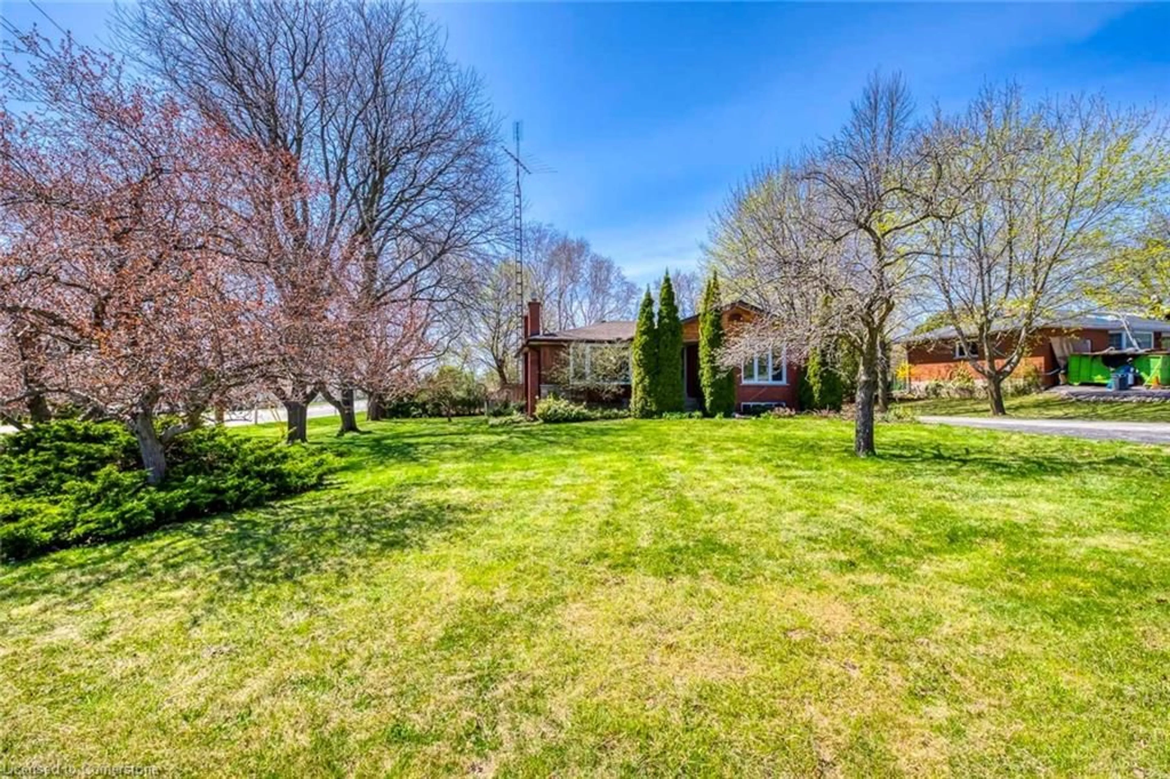 A pic from outside/outdoor area/front of a property/back of a property/a pic from drone, unknown for 57 Mcdonald Crt, Waterdown Ontario L9H 7C1