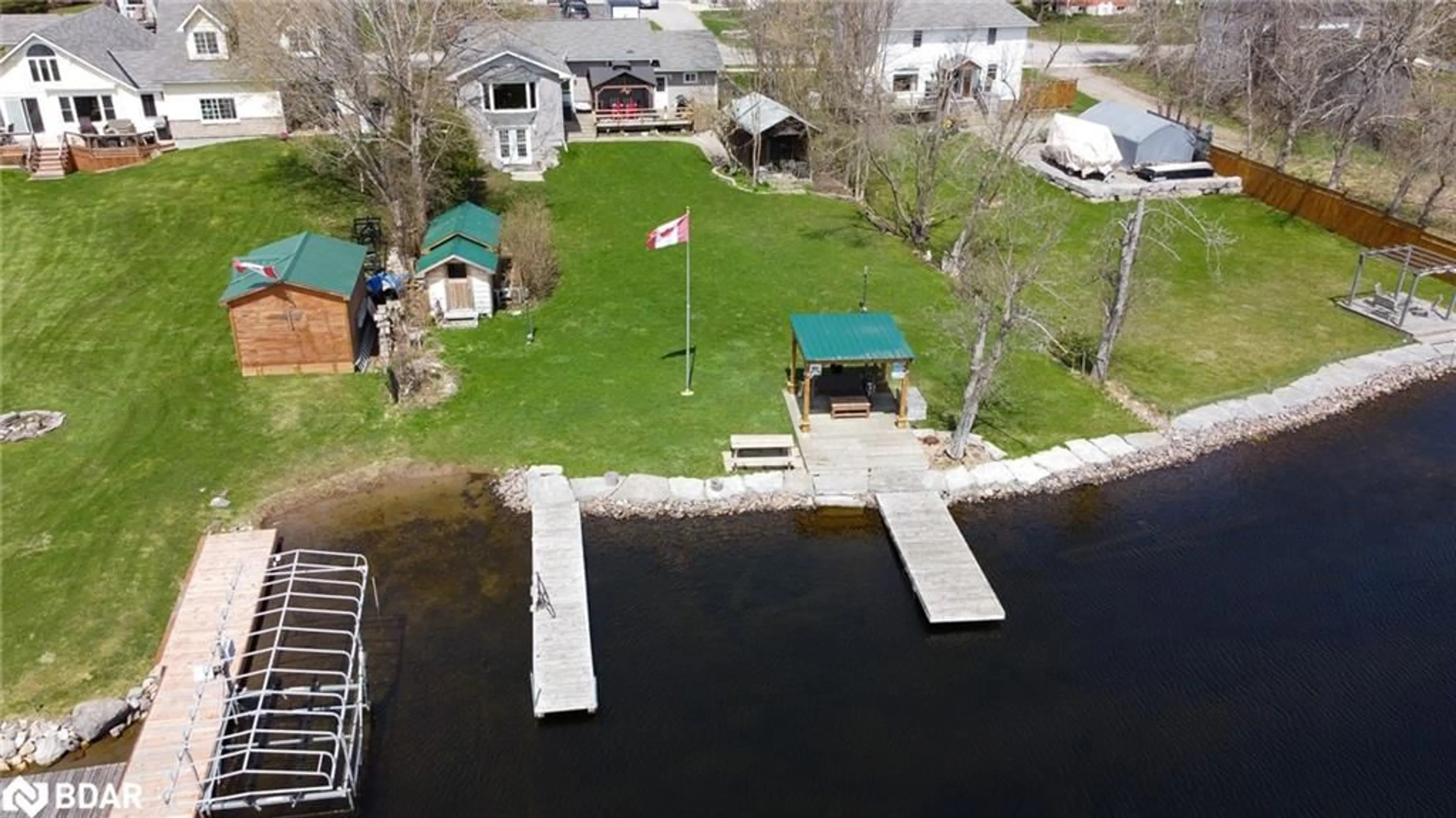 A pic from outside/outdoor area/front of a property/back of a property/a pic from drone, water/lake/river/ocean view for 47 North Water Street St, Coboconk Ontario K0M 1K0