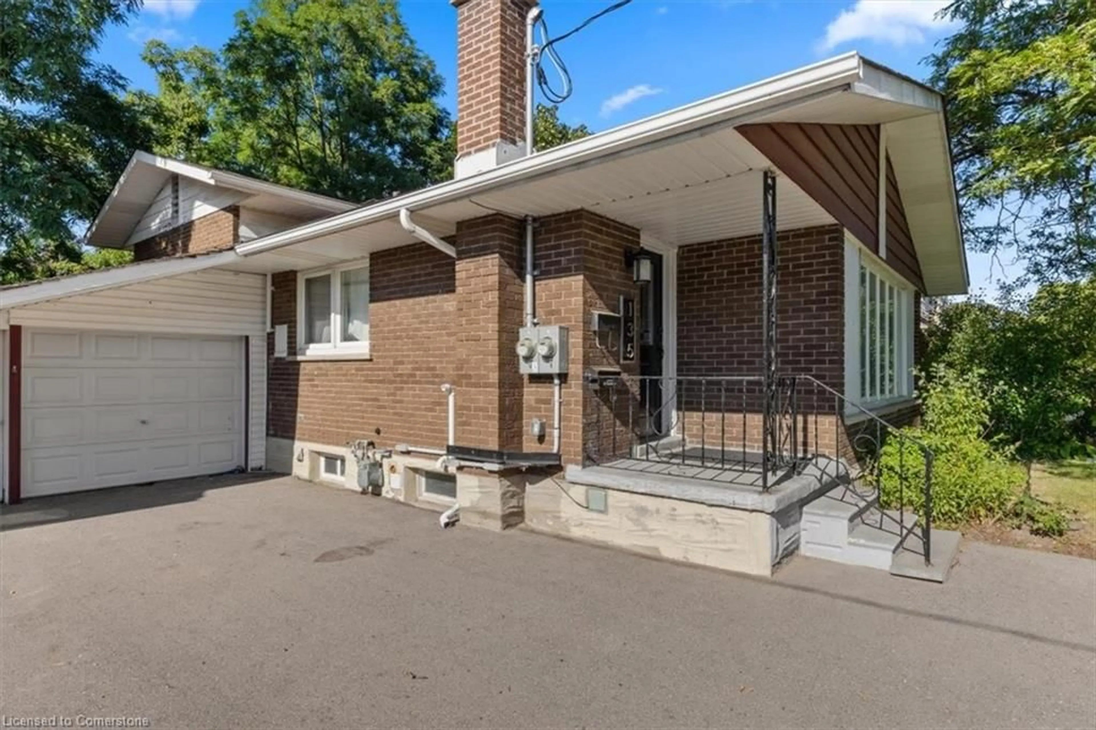 Home with brick exterior material, street for 135 Ruskview Rd, Kitchener Ontario N2M 4S1