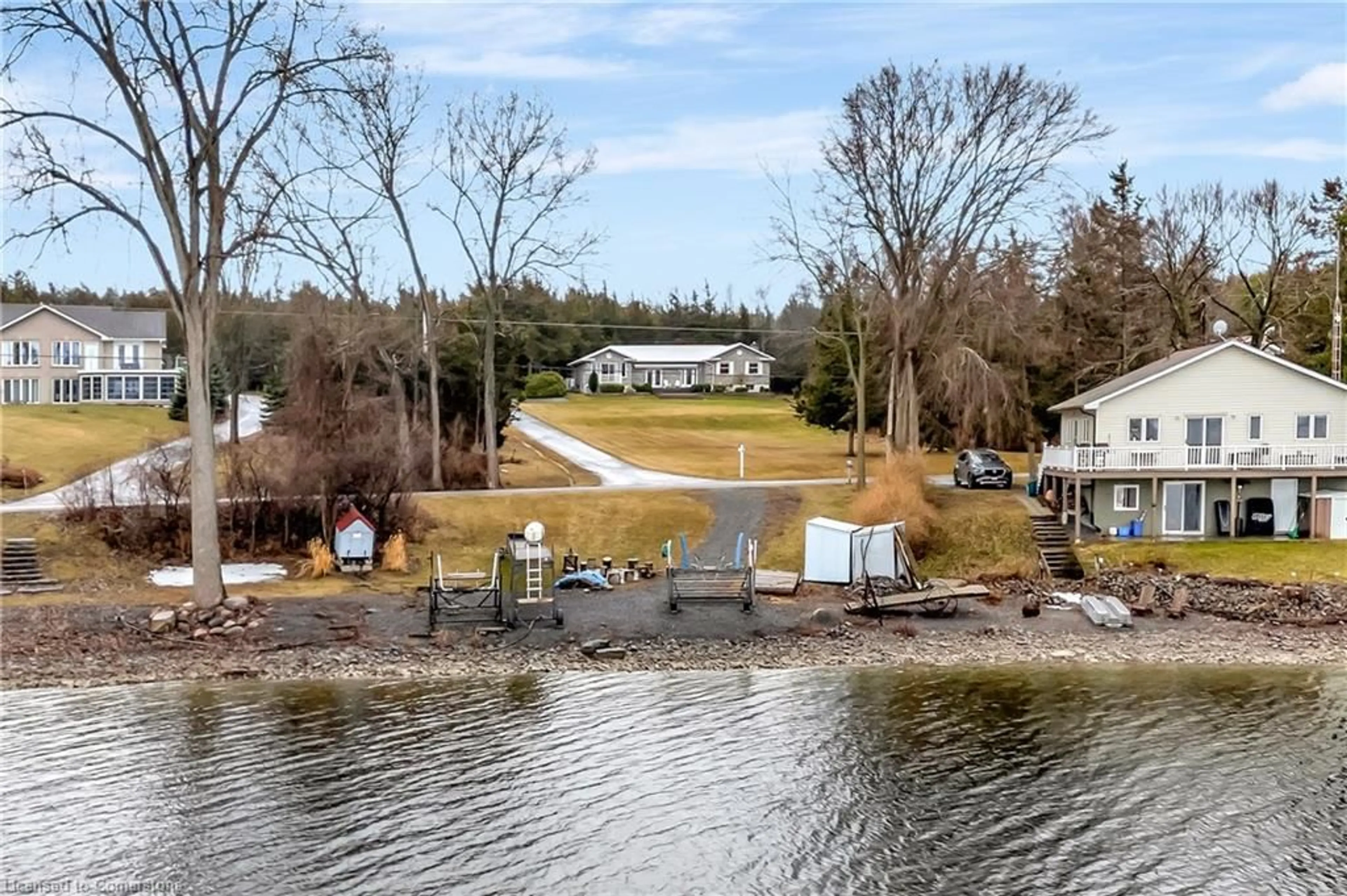 A pic from outside/outdoor area/front of a property/back of a property/a pic from drone, water/lake/river/ocean view for 1708 North Big Island Rd, Demorestville Ontario K0K 1W0