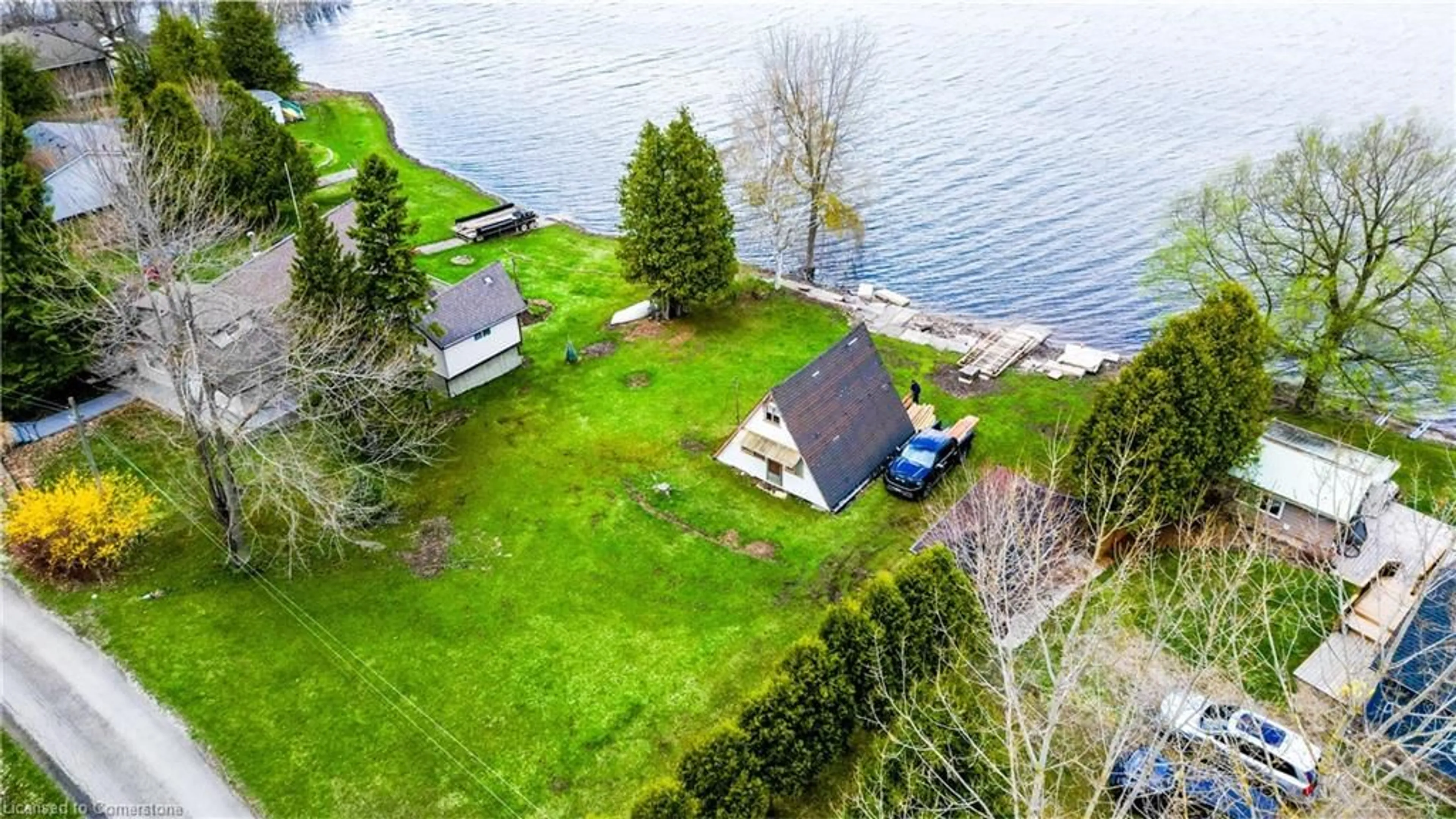 A pic from outside/outdoor area/front of a property/back of a property/a pic from drone, water/lake/river/ocean view for 129 Road 100, Conestogo Lake Ontario N0G 1P0