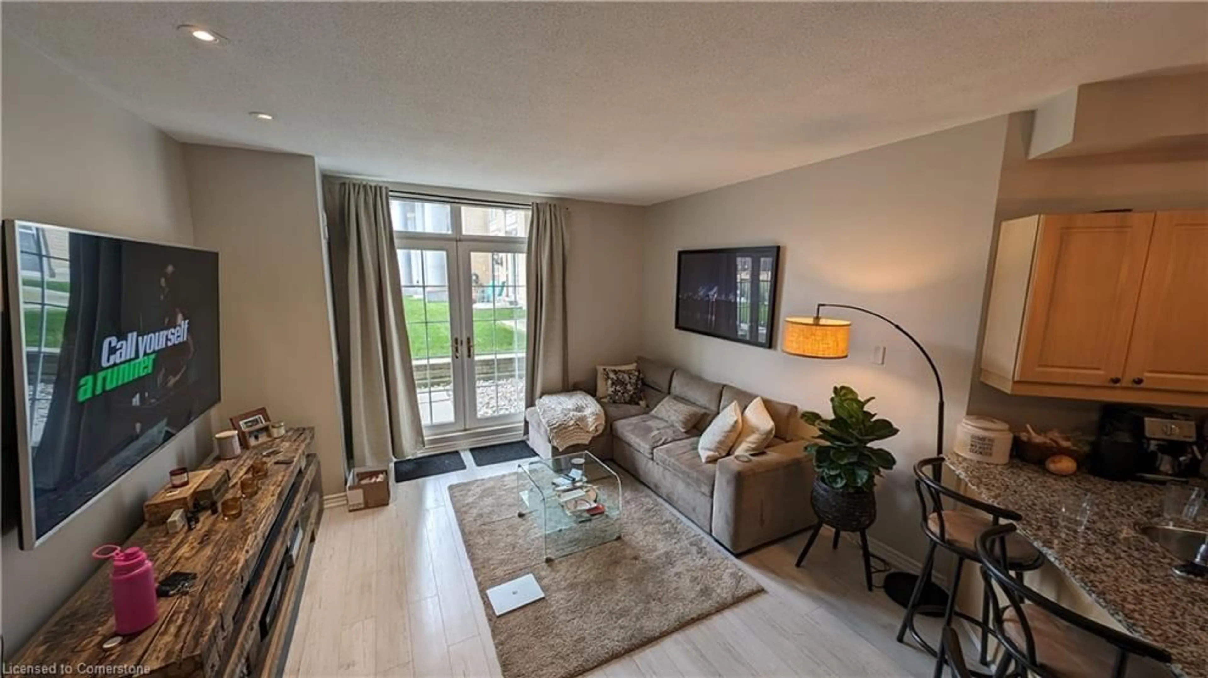 Living room with furniture, unknown for 135 James St #115, Hamilton Ontario L8P 2Z6