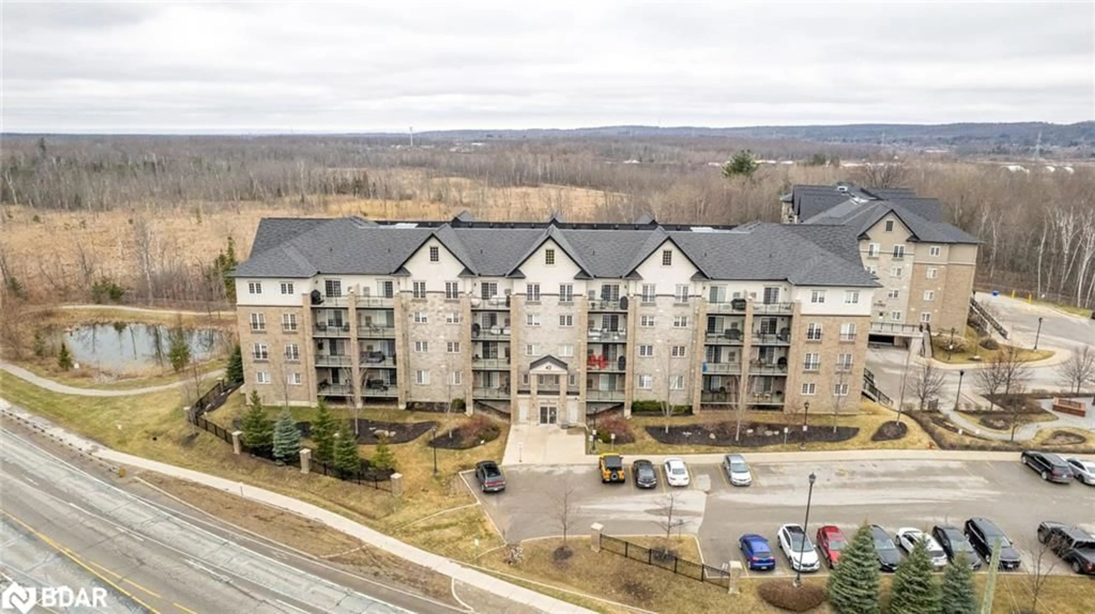 A pic from outside/outdoor area/front of a property/back of a property/a pic from drone, unknown for 42 Ferndale Dr #107, Barrie Ontario L4N 2M5