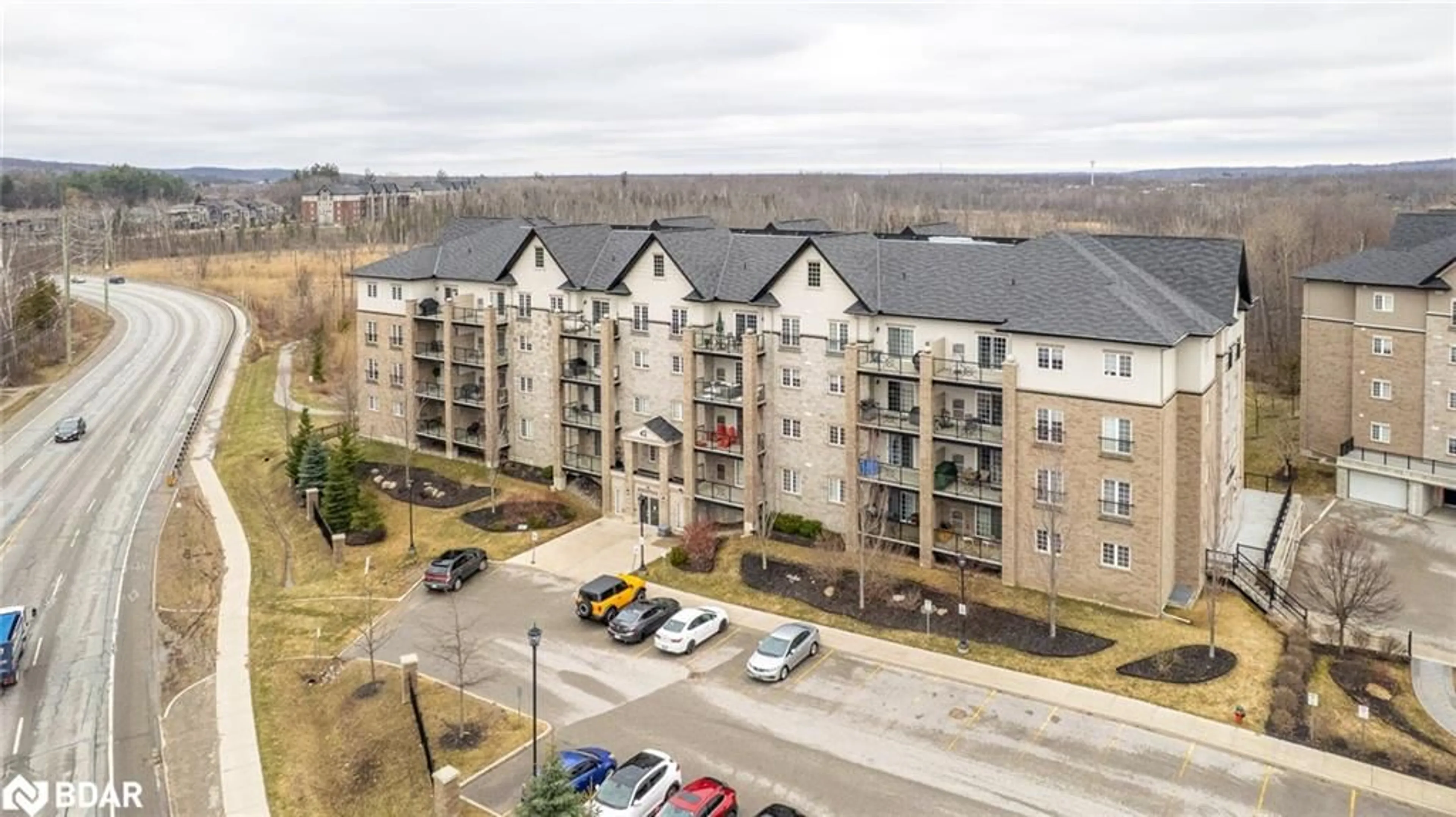 A pic from outside/outdoor area/front of a property/back of a property/a pic from drone, city buildings view from balcony for 42 Ferndale Dr #107, Barrie Ontario L4N 2M5