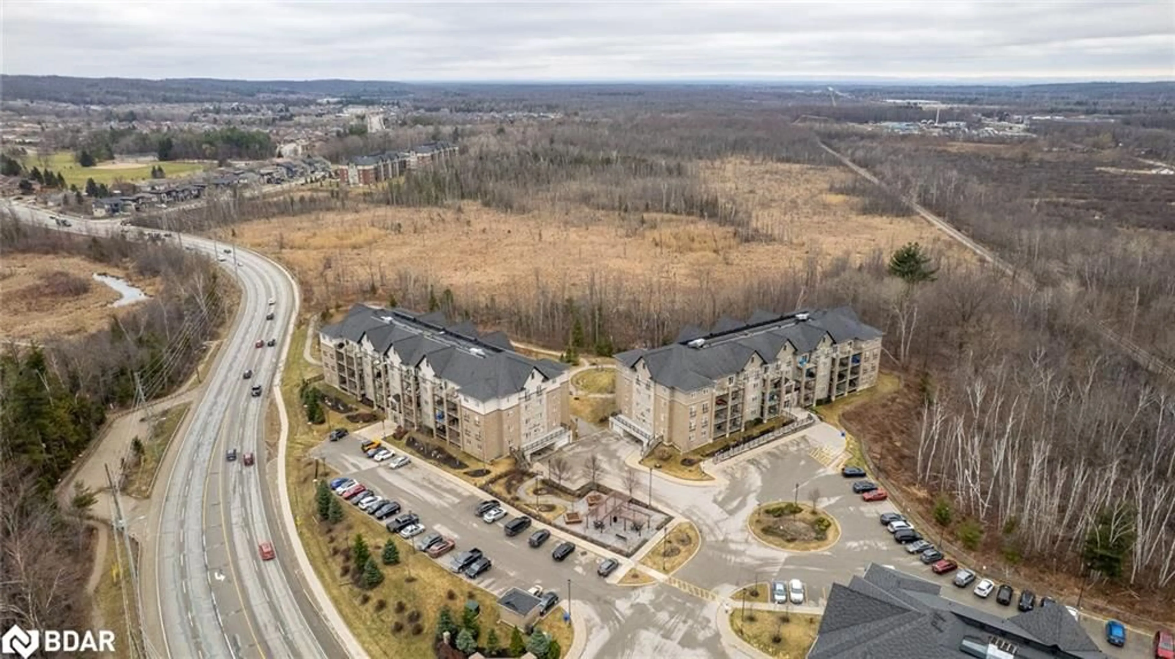A pic from outside/outdoor area/front of a property/back of a property/a pic from drone, mountain view for 42 Ferndale Dr #107, Barrie Ontario L4N 2M5