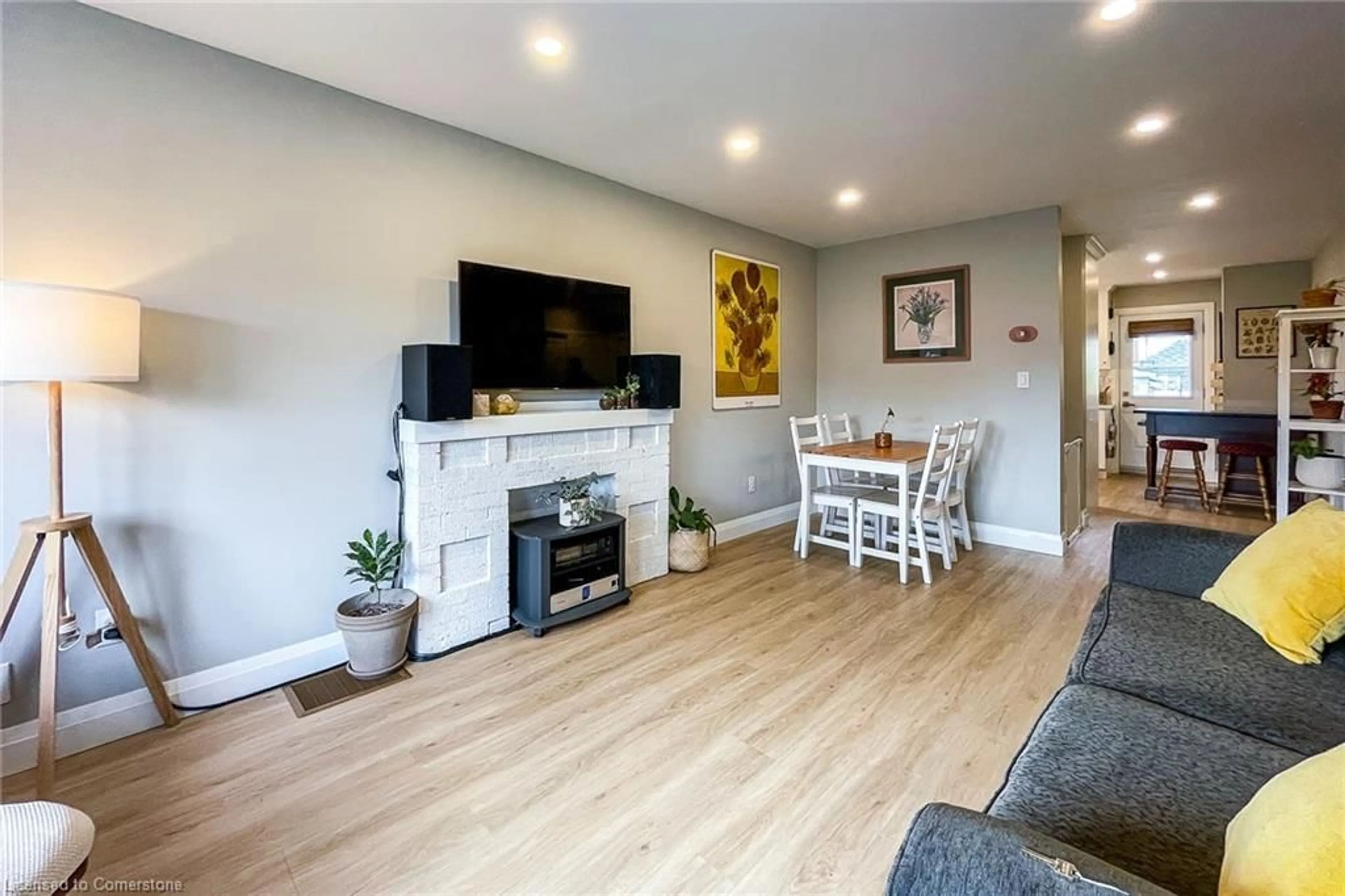Living room with furniture, wood/laminate floor for 112 Tragina Ave, Hamilton Ontario L8K 2Z6