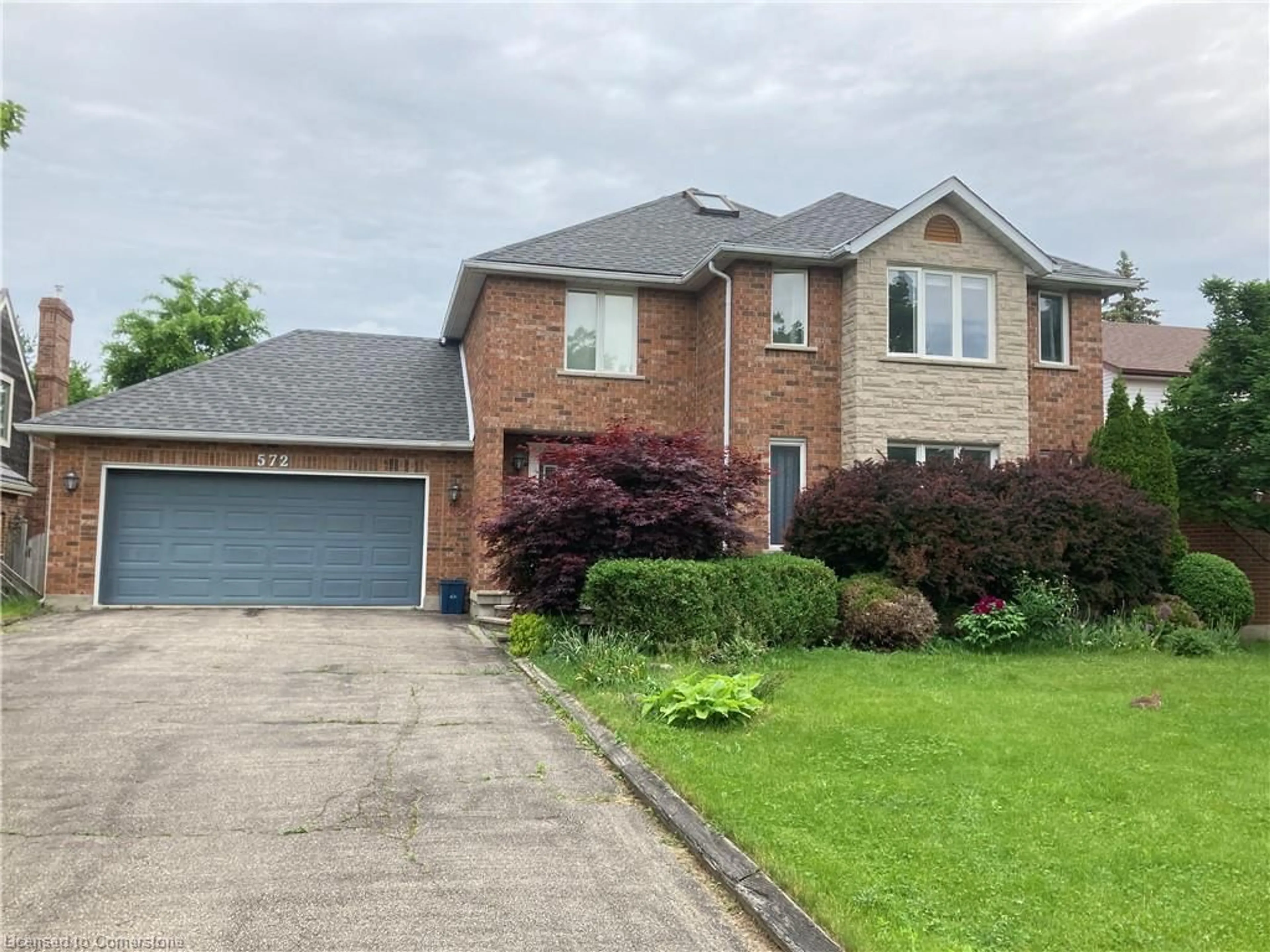 Home with brick exterior material, street for 572 Sandbury Lane, Waterloo Ontario N2T 1Z5