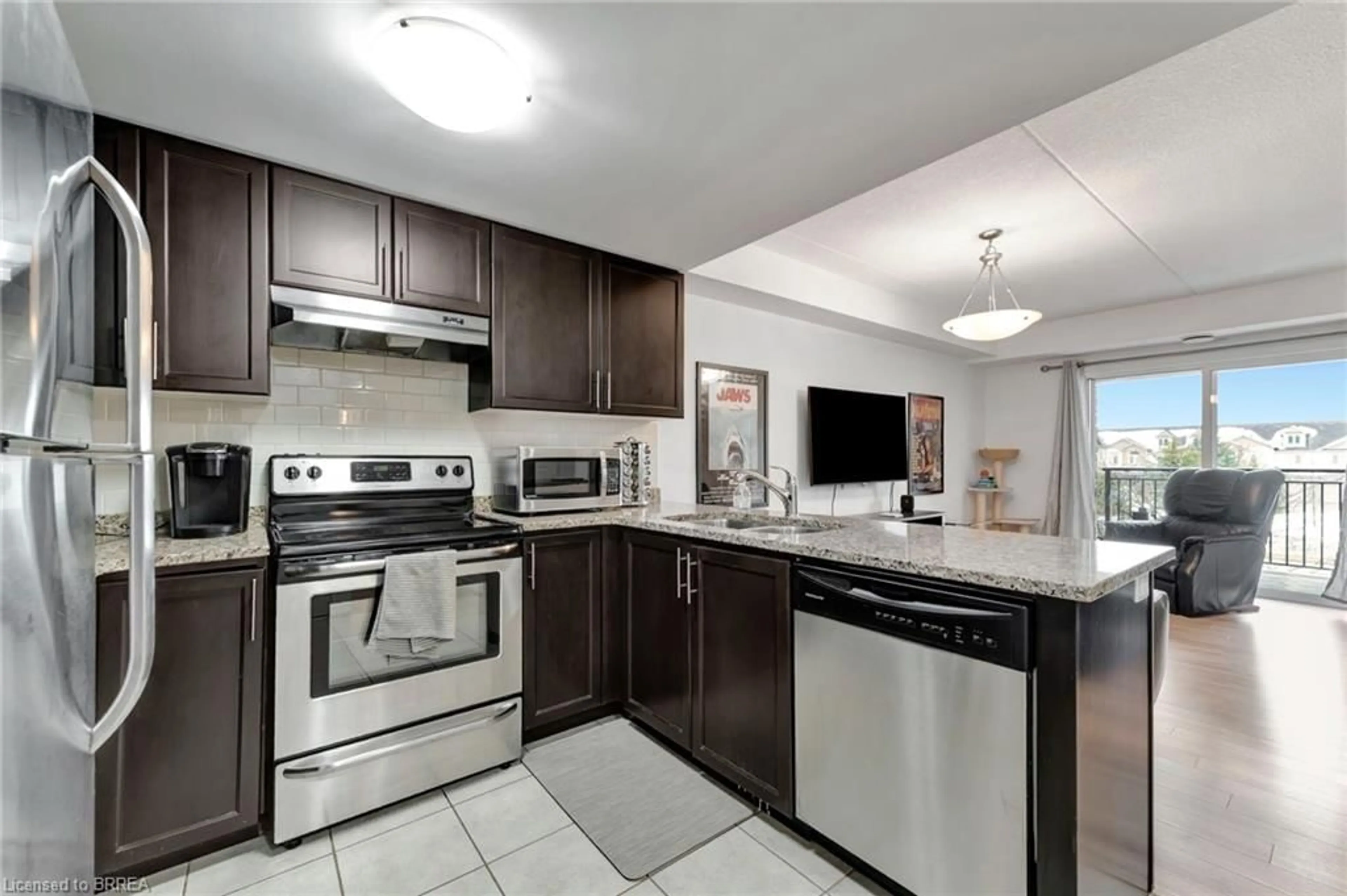Open concept kitchen, ceramic/tile floor for 45 Kingsbury Sq #213, Guelph Ontario N1L 0L2