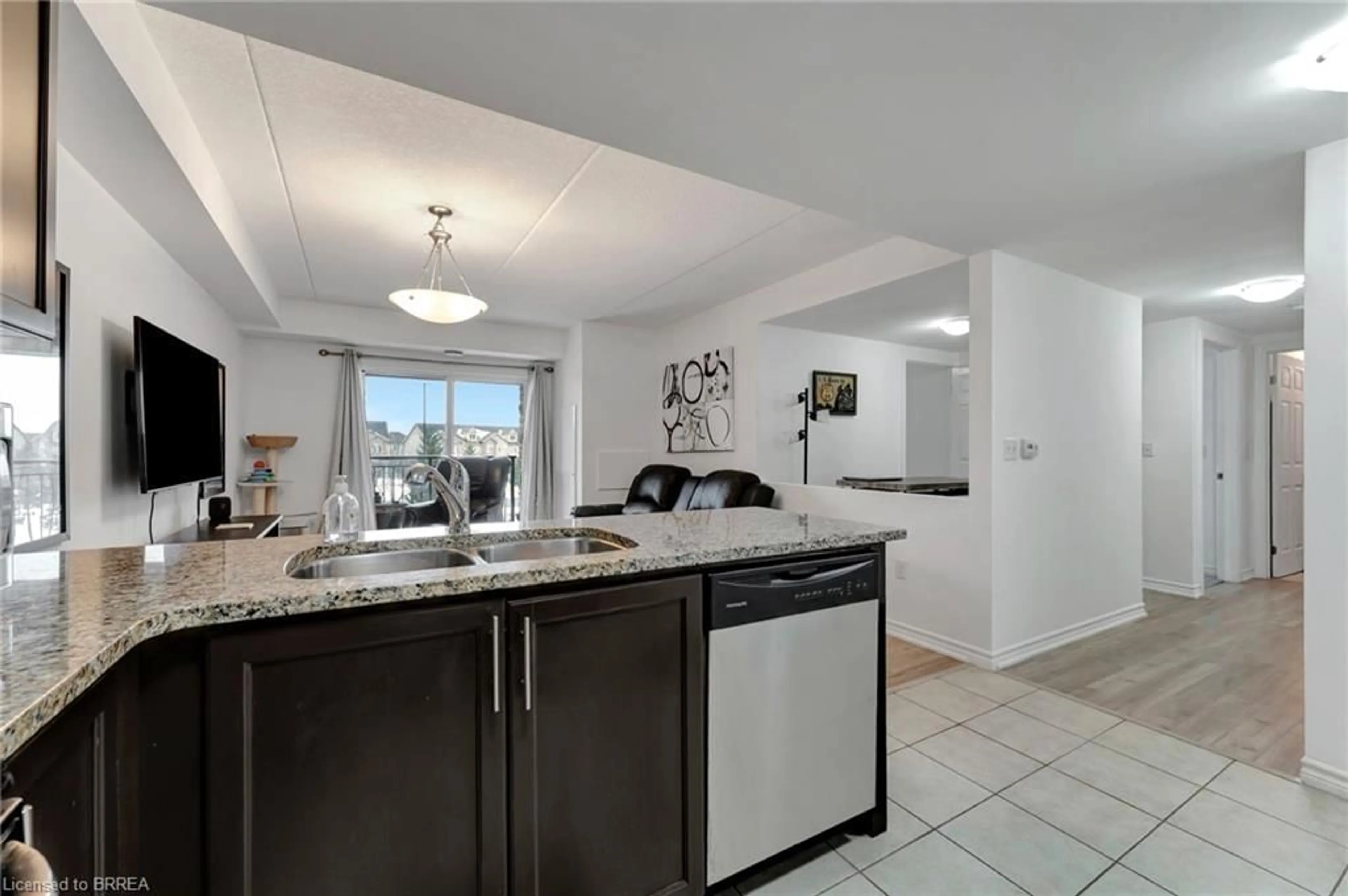 Open concept kitchen, ceramic/tile floor for 45 Kingsbury Sq #213, Guelph Ontario N1L 0L2