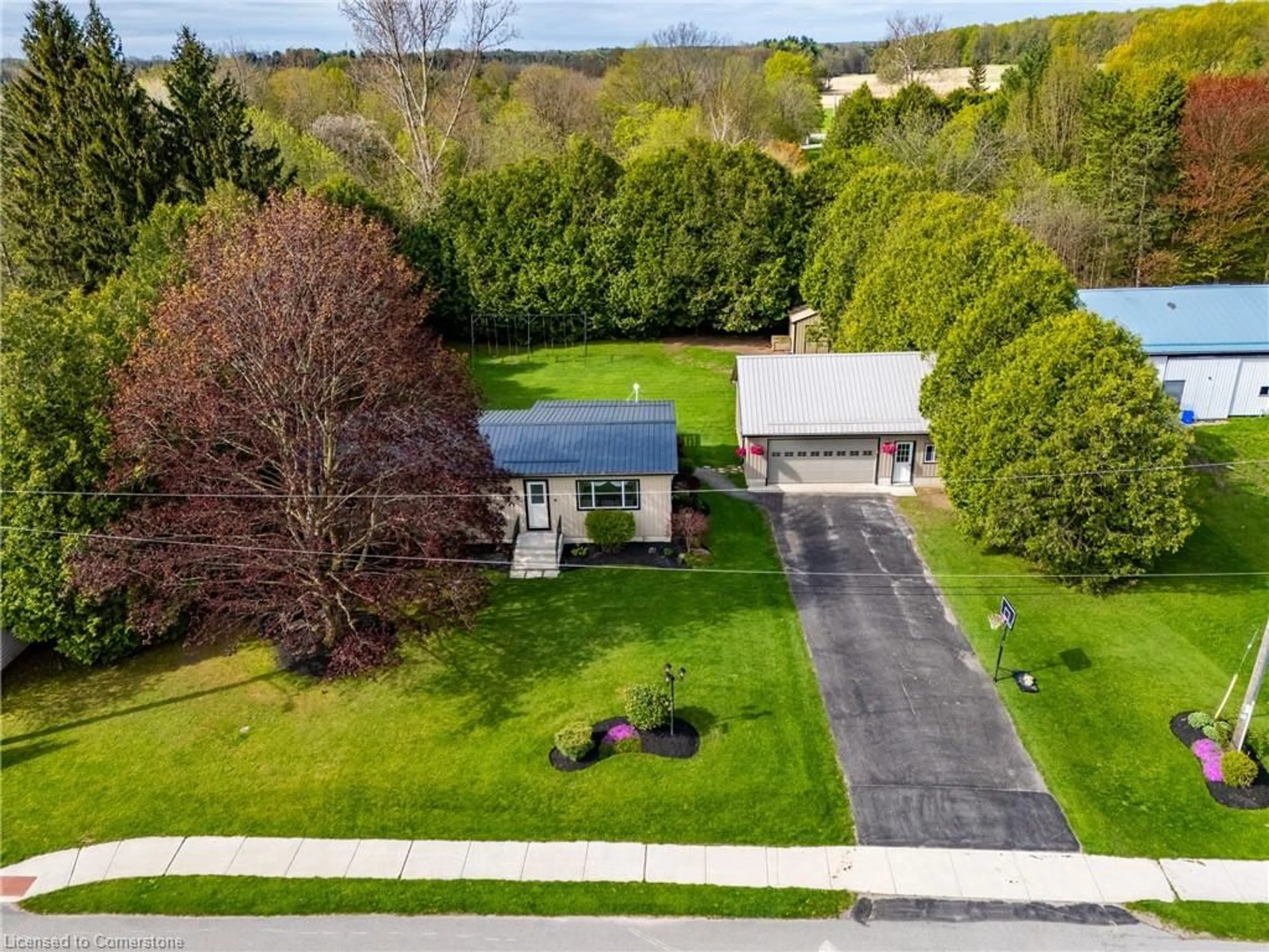 A pic from outside/outdoor area/front of a property/back of a property/a pic from drone, street for 53905 John St, Richmond Ontario N5H 2R1
