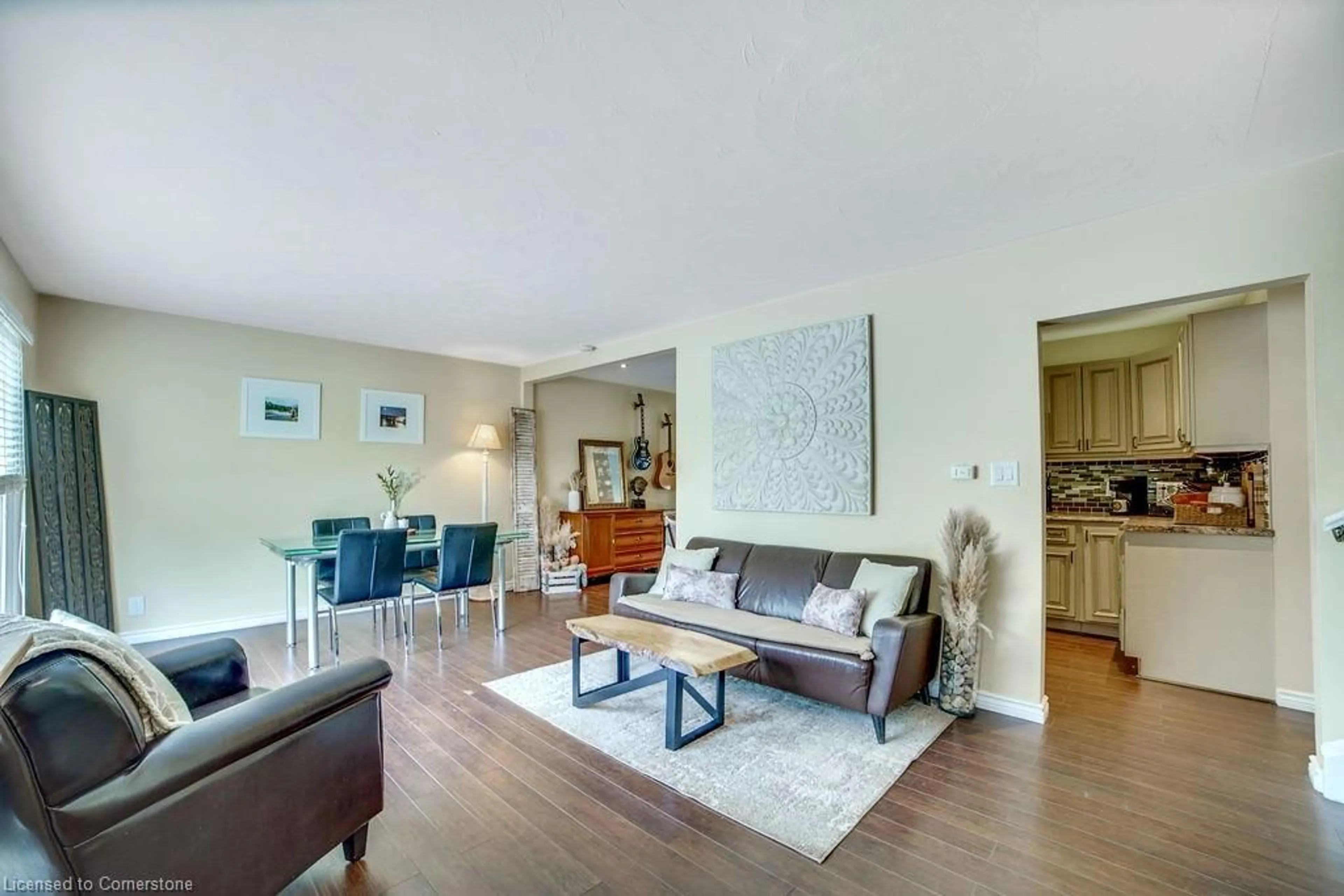 Living room with furniture, wood/laminate floor for 17 White Oaks Ave, Brantford Ontario N3R 5N8