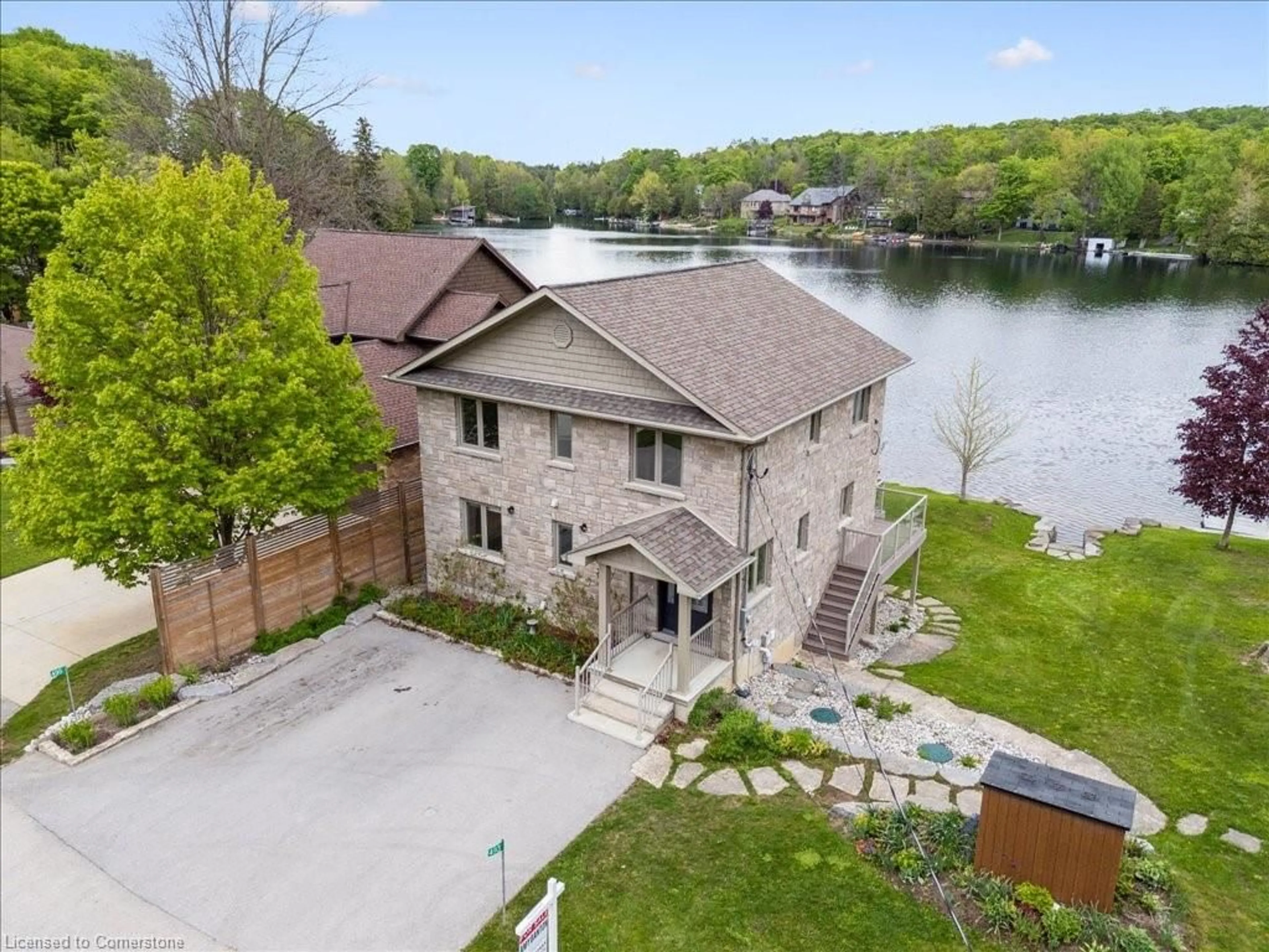 A pic from outside/outdoor area/front of a property/back of a property/a pic from drone, water/lake/river/ocean view for 493 Lake Rosalind Rd 4, Hanover Ontario N4N 3B9