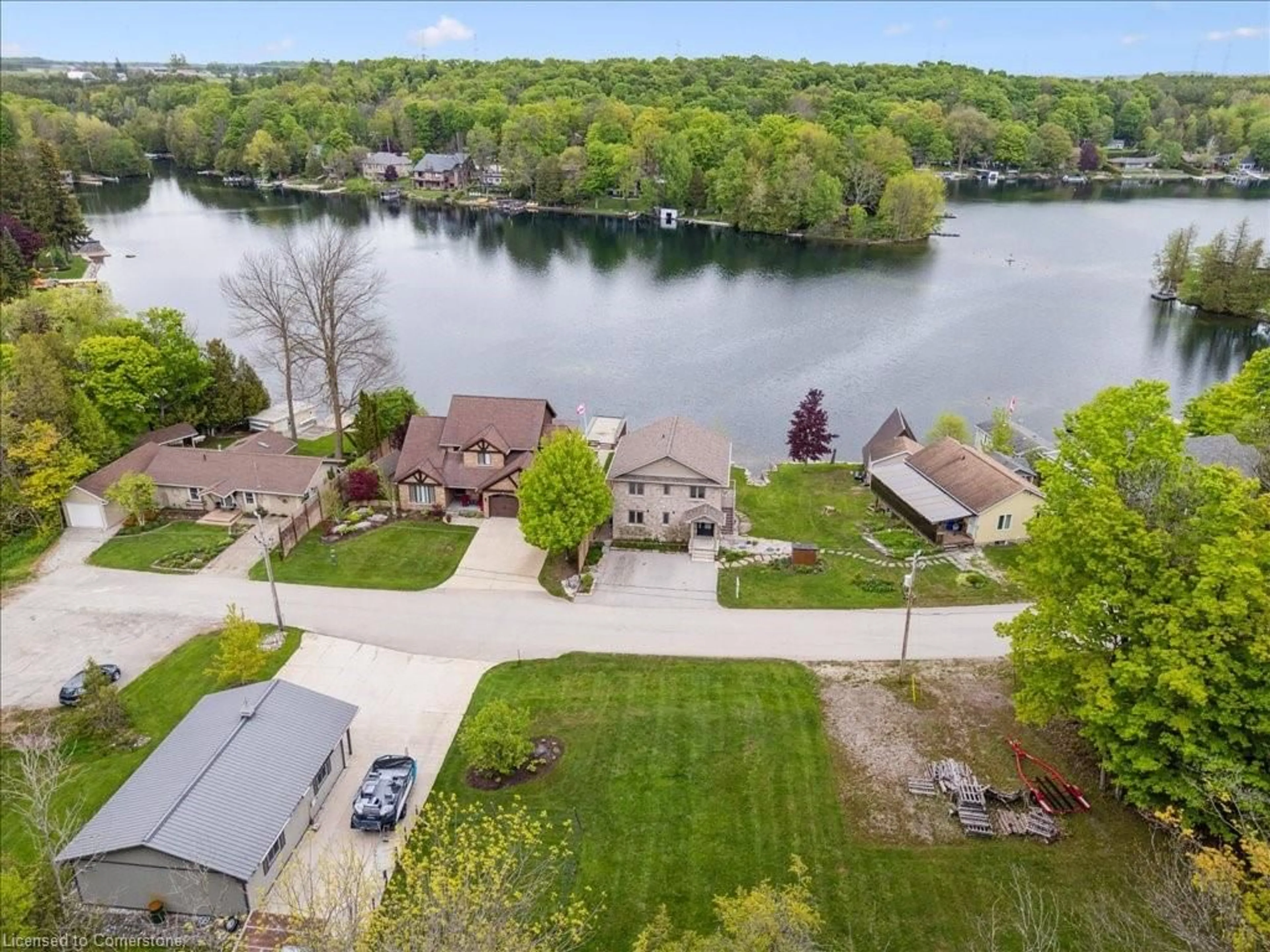 A pic from outside/outdoor area/front of a property/back of a property/a pic from drone, water/lake/river/ocean view for 493 Lake Rosalind Rd 4, Hanover Ontario N4N 3B9