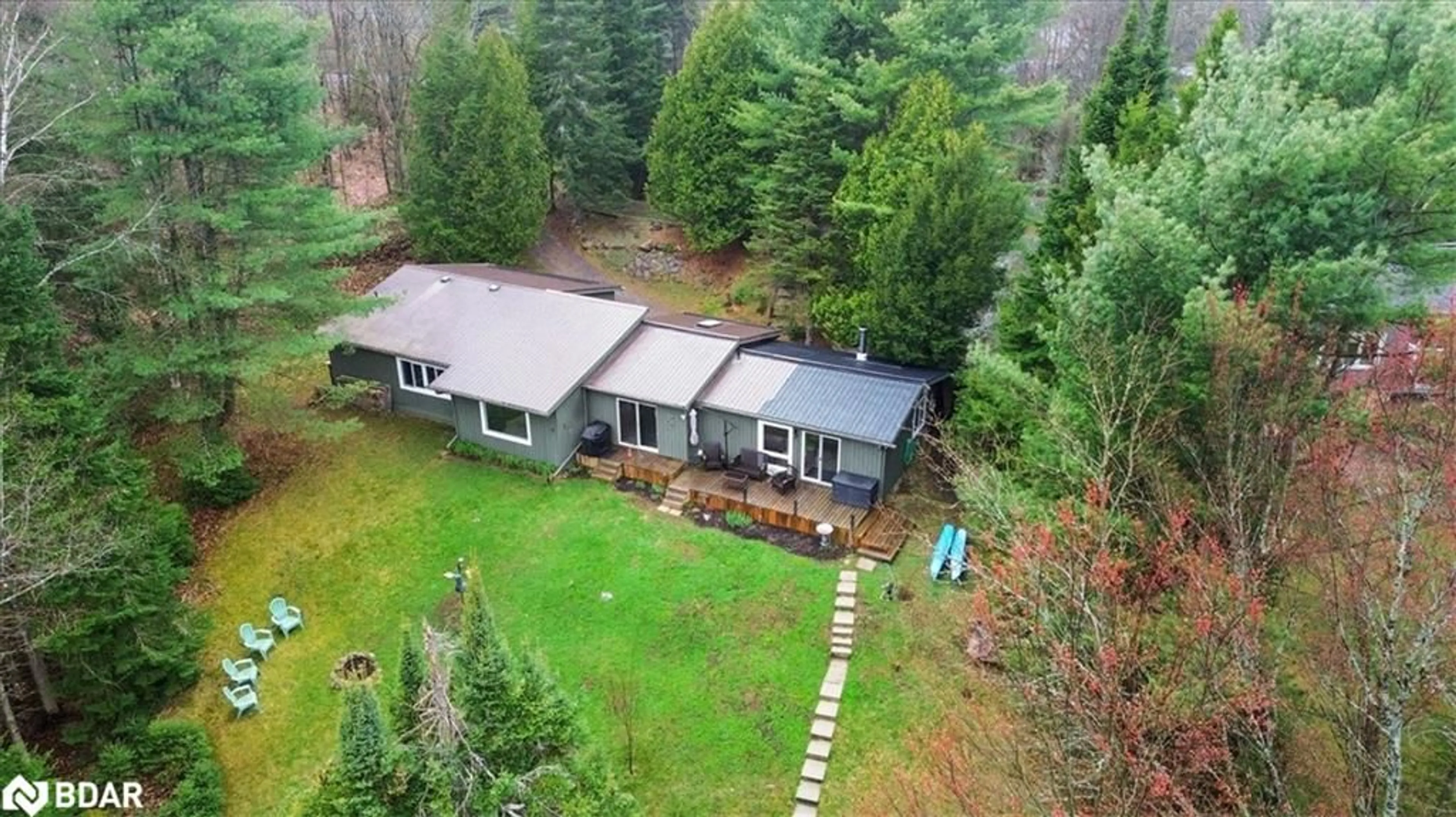 A pic from outside/outdoor area/front of a property/back of a property/a pic from drone, forest/trees view for 1017 Rays Lane, Minden Ontario K0M 2K0