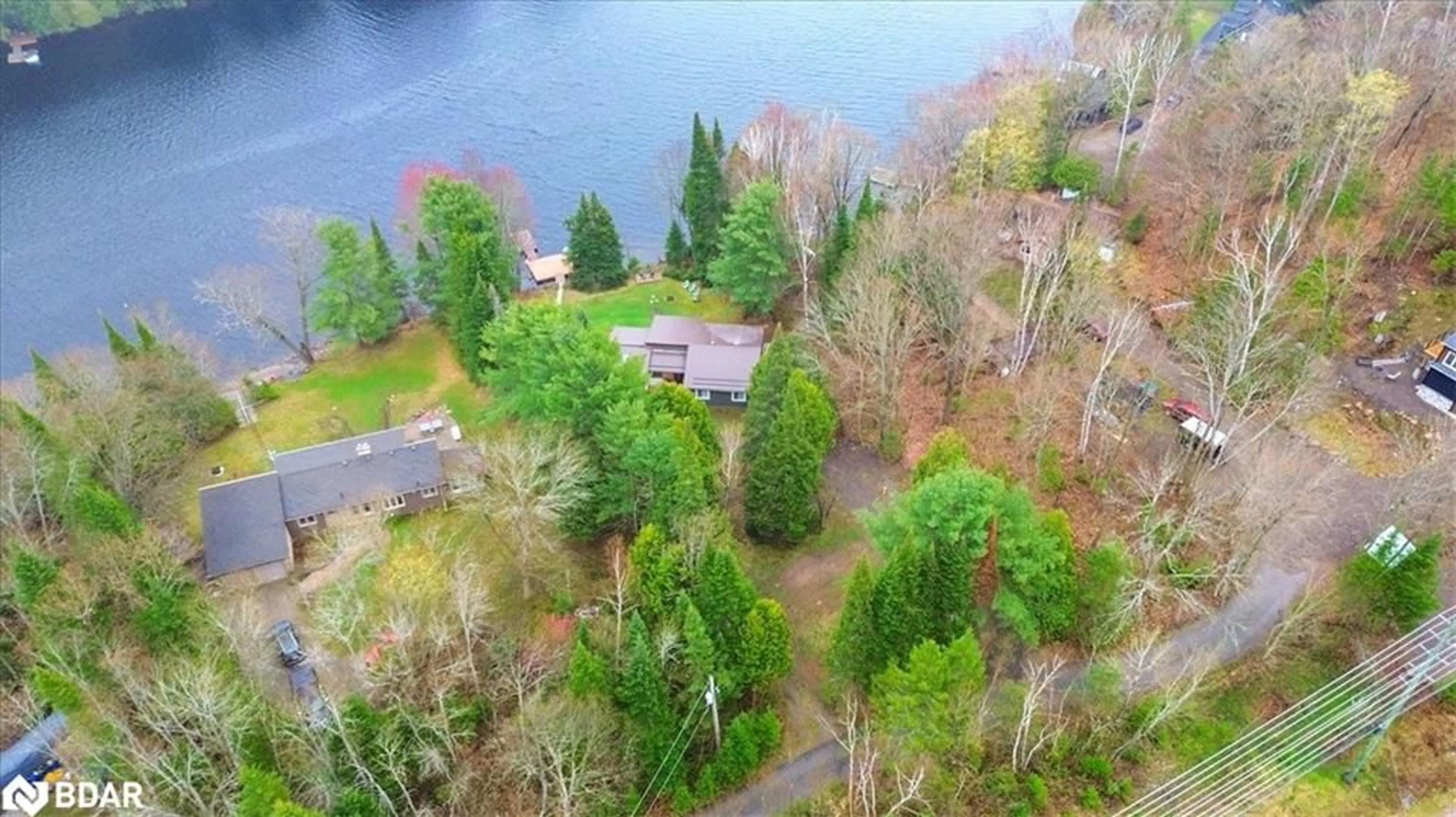 A pic from outside/outdoor area/front of a property/back of a property/a pic from drone, water/lake/river/ocean view for 1017 Rays Lane, Minden Ontario K0M 2K0