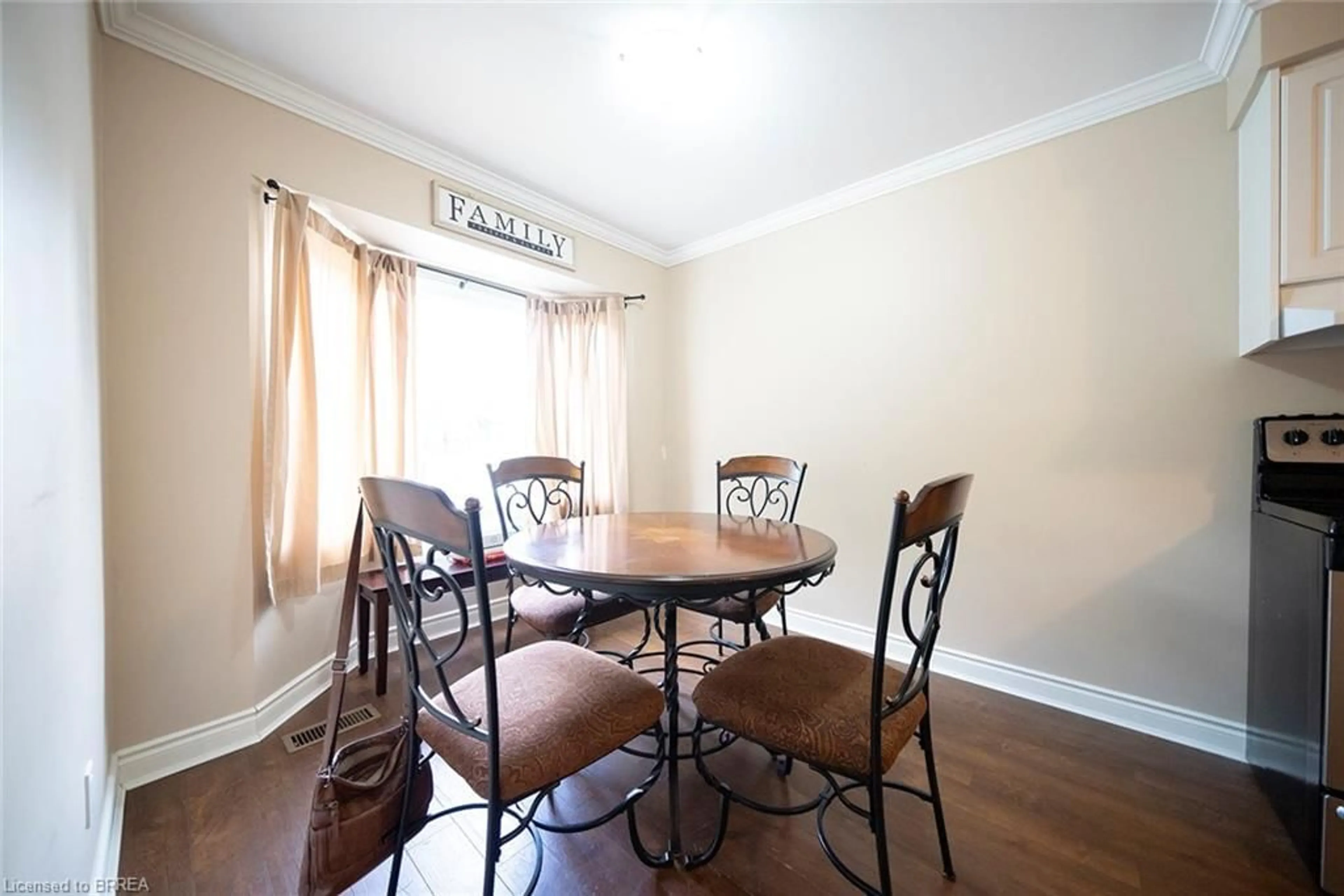 Dining room, wood/laminate floor for 153 Brantwood Park Rd #F, Brantford Ontario N3P 1X9