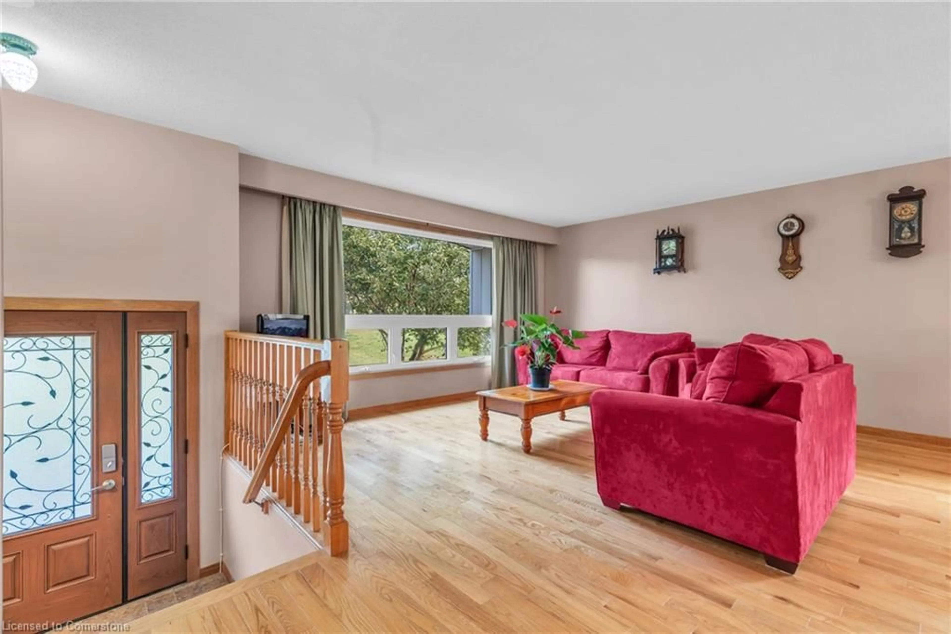 Living room with furniture, wood/laminate floor for 2 Hamilton Dr, Guelph/Eramosa Ontario N1E 0N9