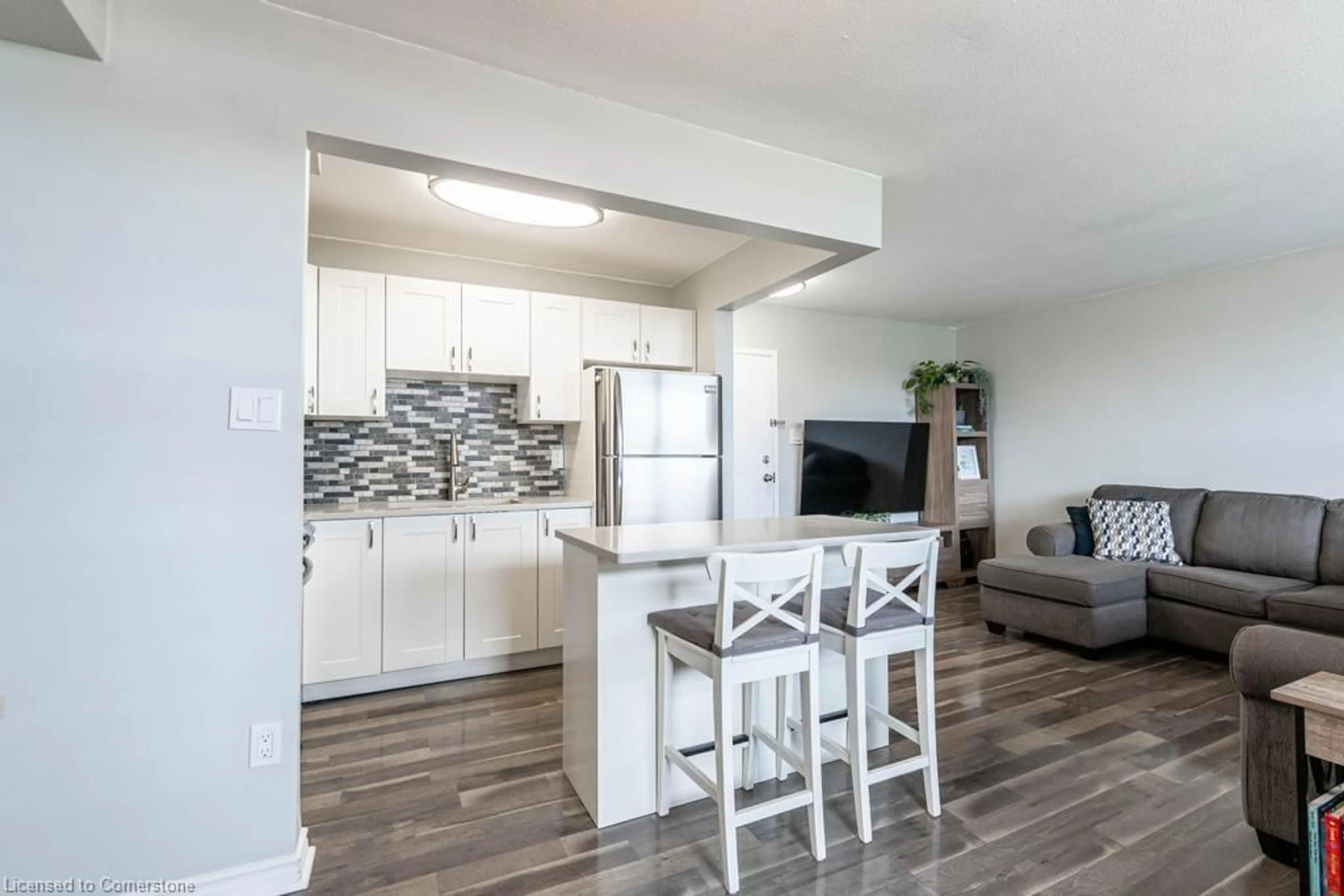 Open concept kitchen, wood/laminate floor for 15 Nicklaus Dr #407, Hamilton Ontario L8K 5J5