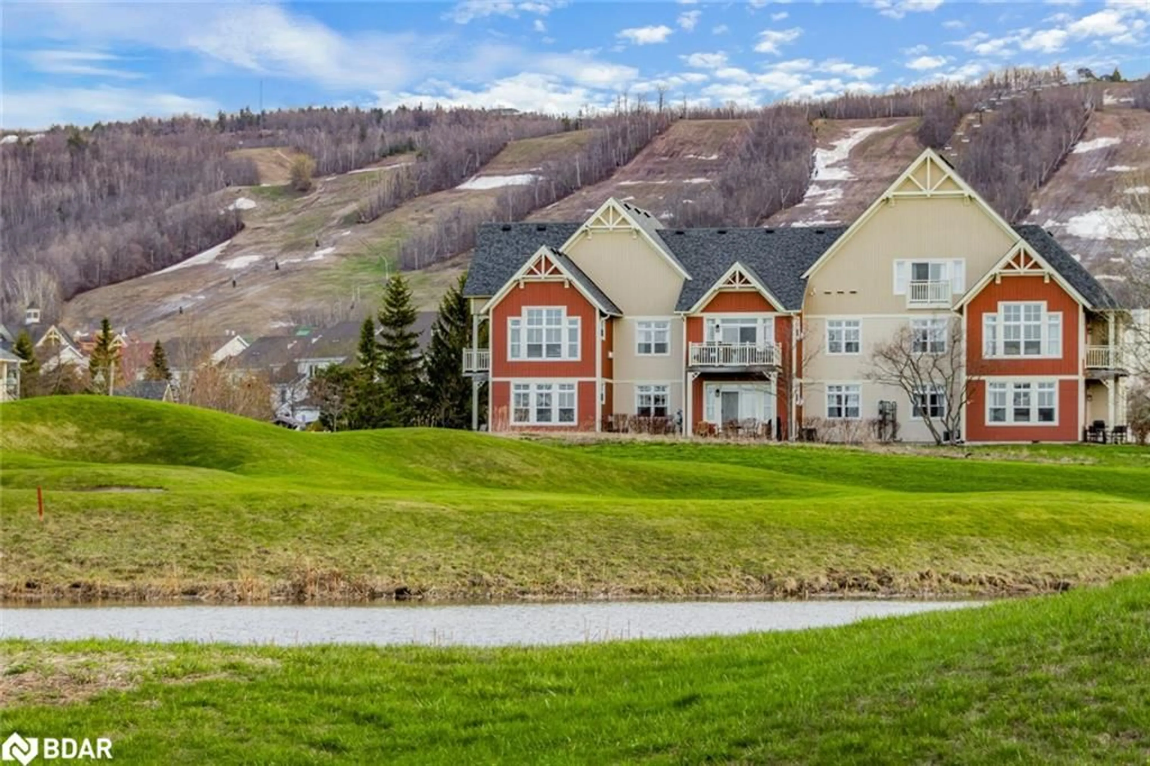 A pic from outside/outdoor area/front of a property/back of a property/a pic from drone, water/lake/river/ocean view for 130 Fairway Court Crt #229, The Blue Mountains Ontario N3W 1Y1