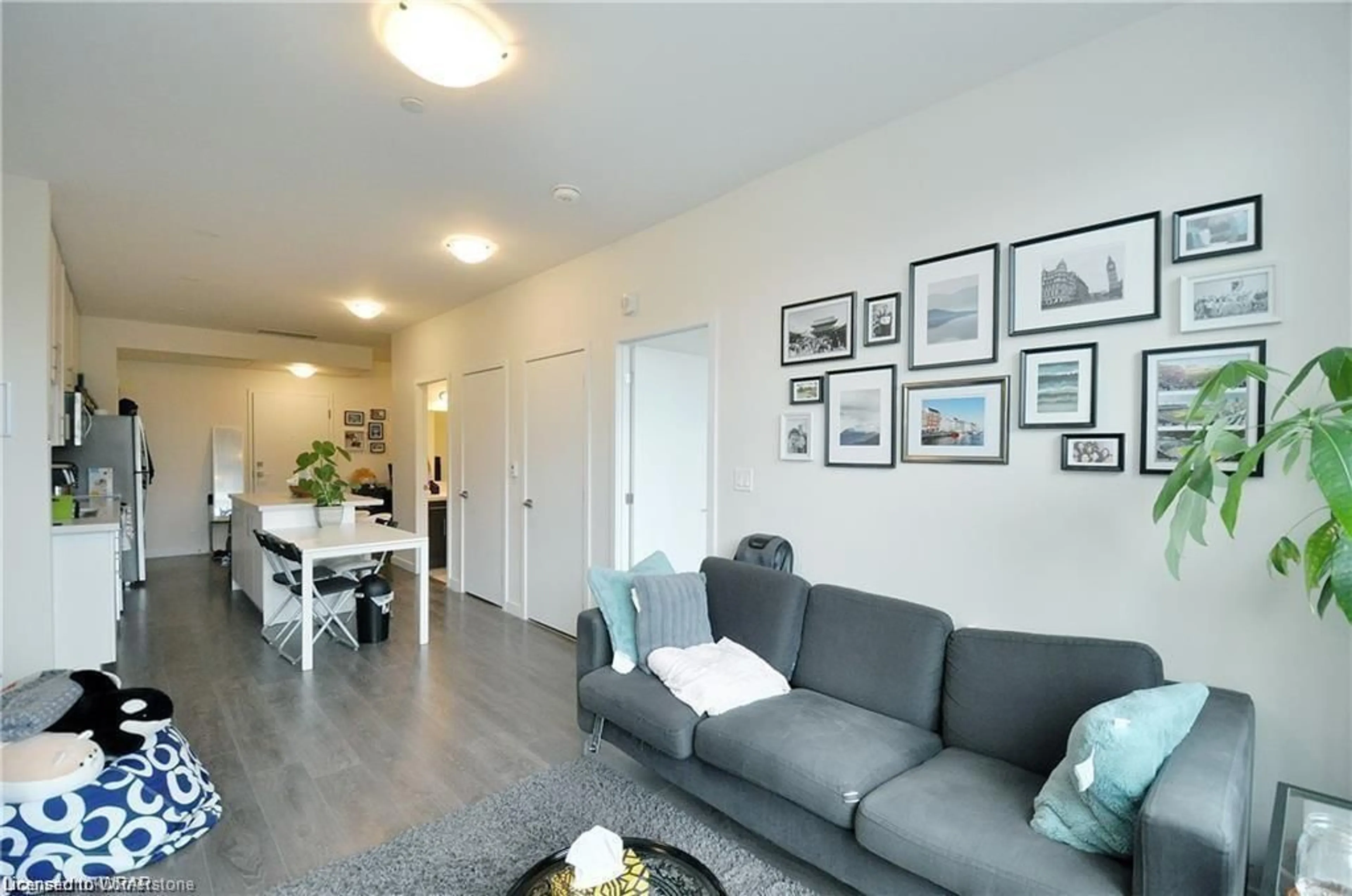 Living room with furniture, wood/laminate floor for 690 King St #221, Kitchener Ontario N2G 1G4