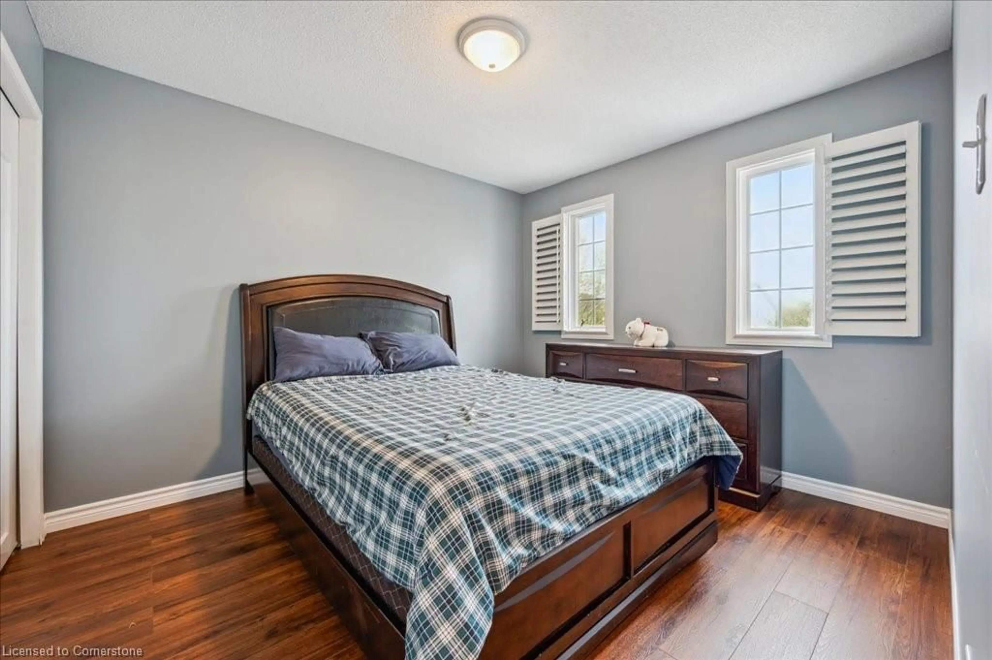 Bedroom with bed, wood/laminate floor for 519 Commonwealth Cres, Kitchener Ontario N2E 4K2