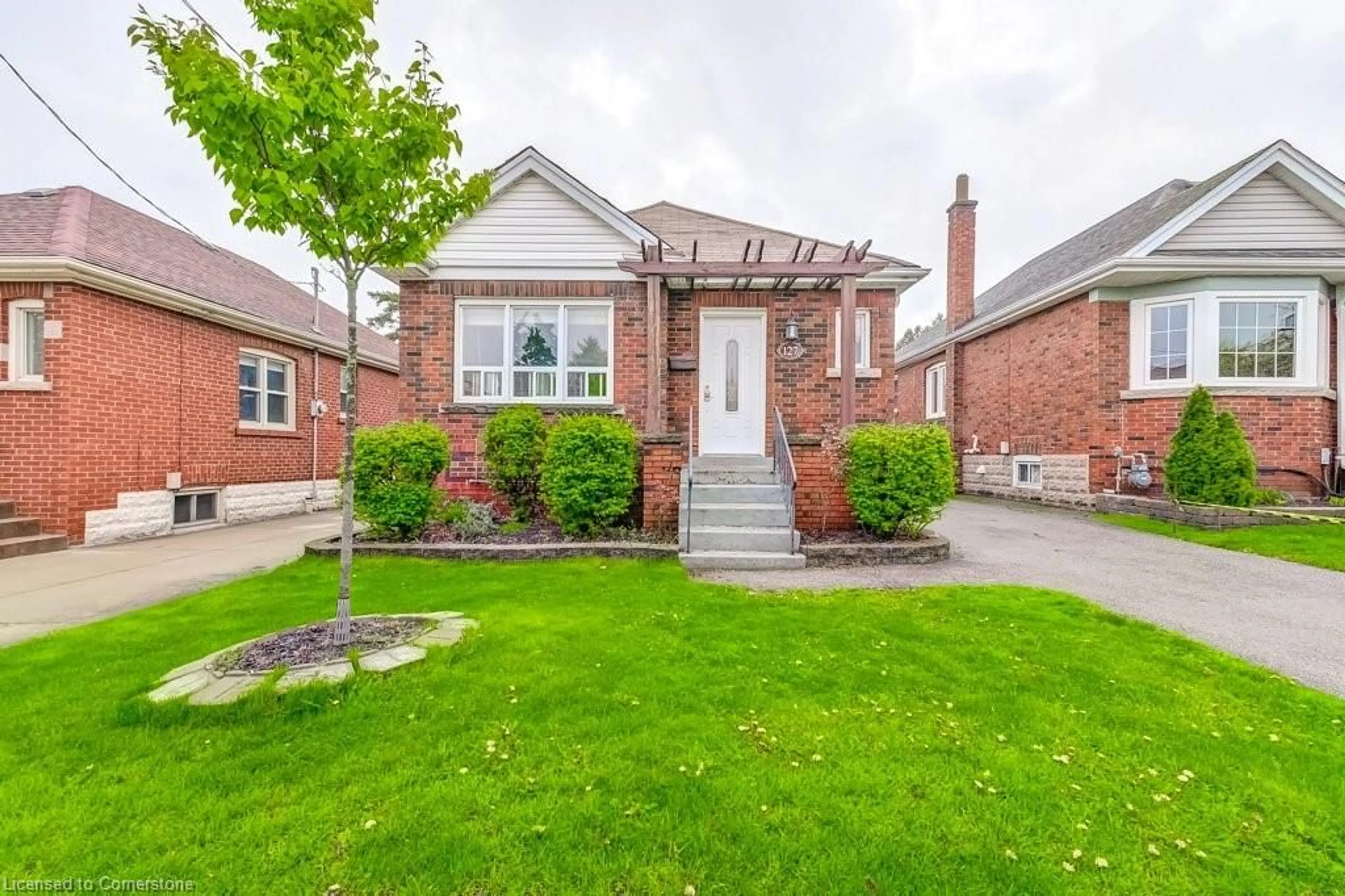 Home with brick exterior material, street for 127 Barons Ave, Hamilton Ontario L8K 2Y8