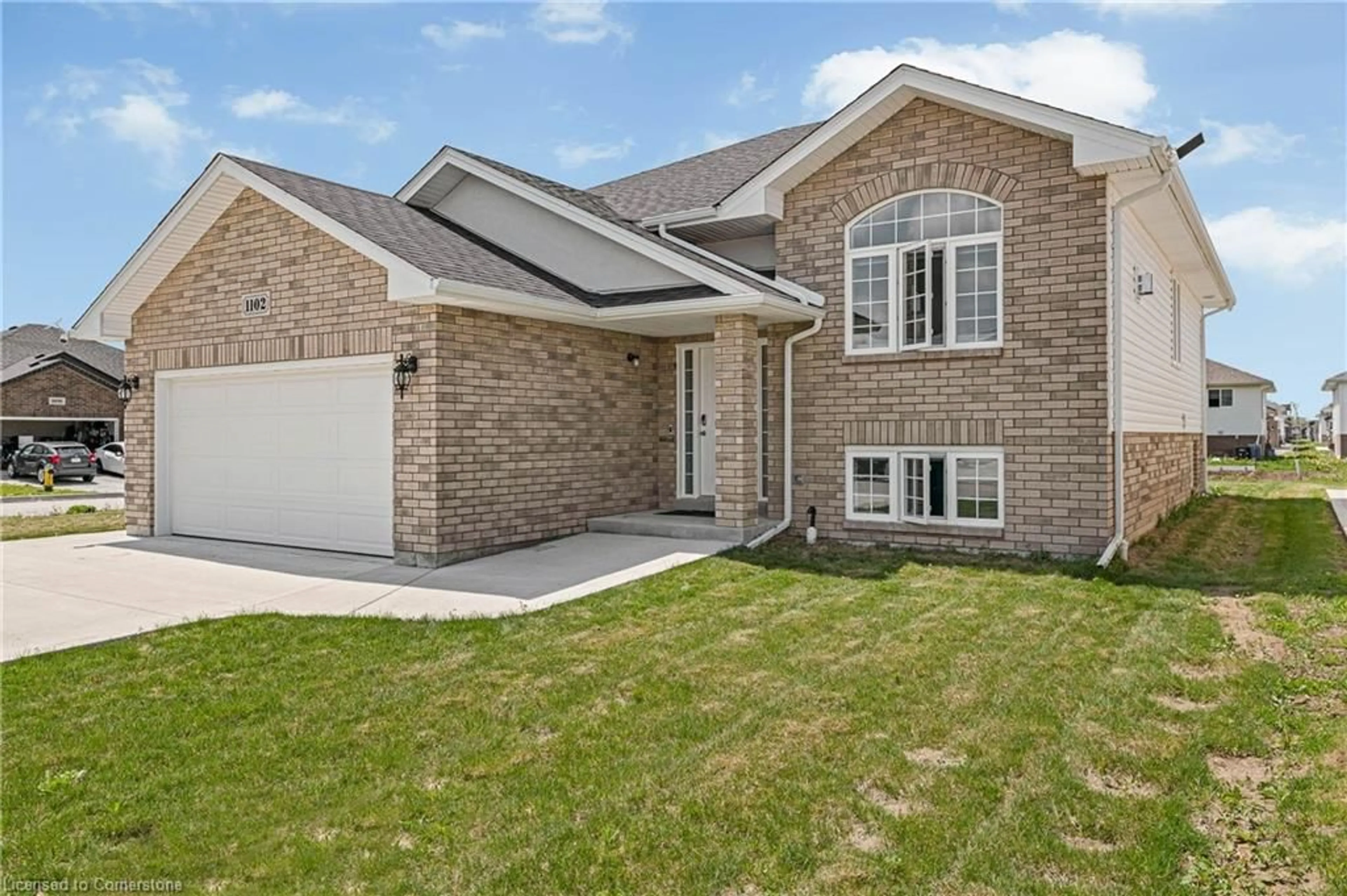 Home with brick exterior material, street for 1102 Aspen Ridge Cres, Belle River Ontario N8L 1B2