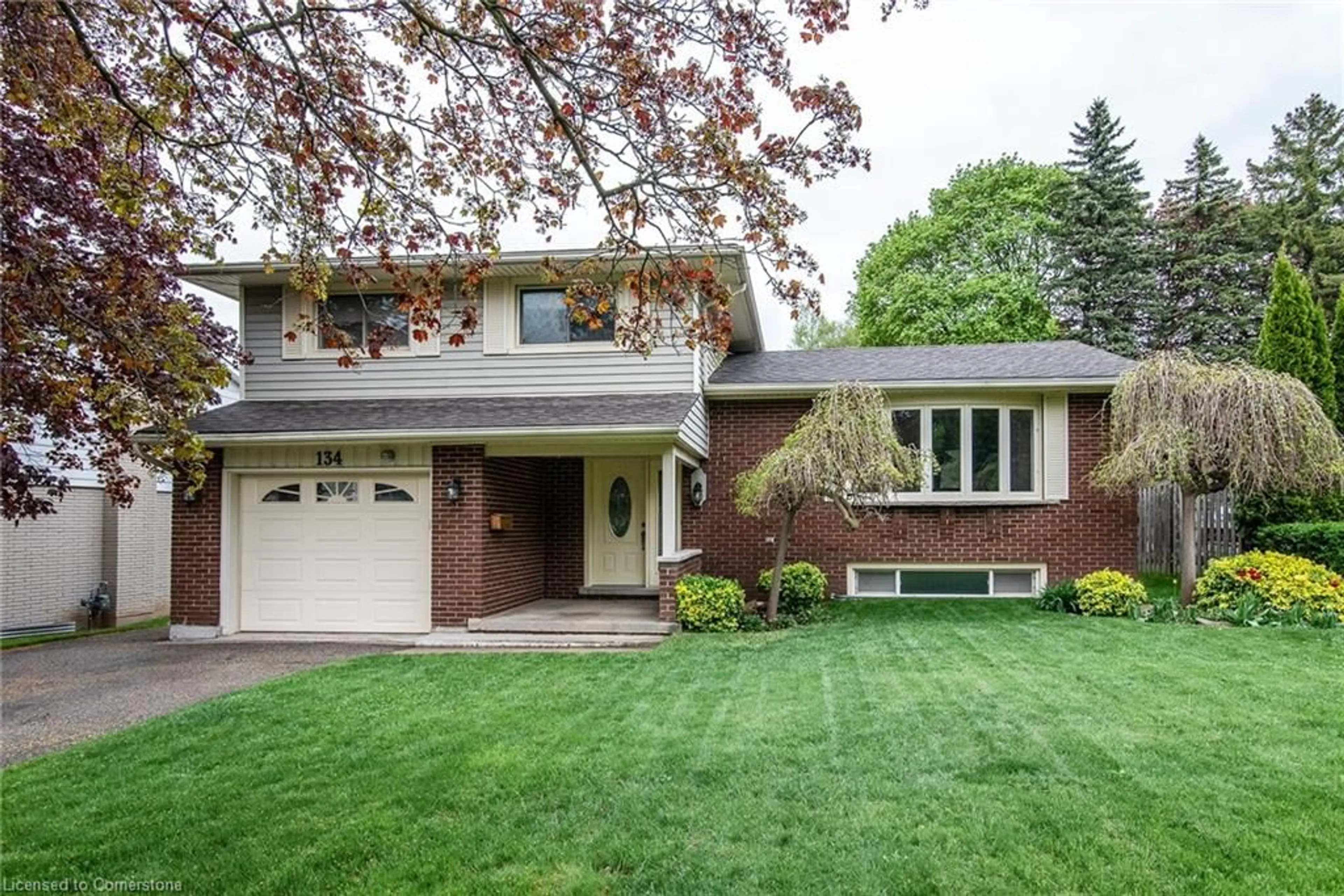 Home with brick exterior material, street for 134 Meaford Dr, Waterloo Ontario N2J 3T9