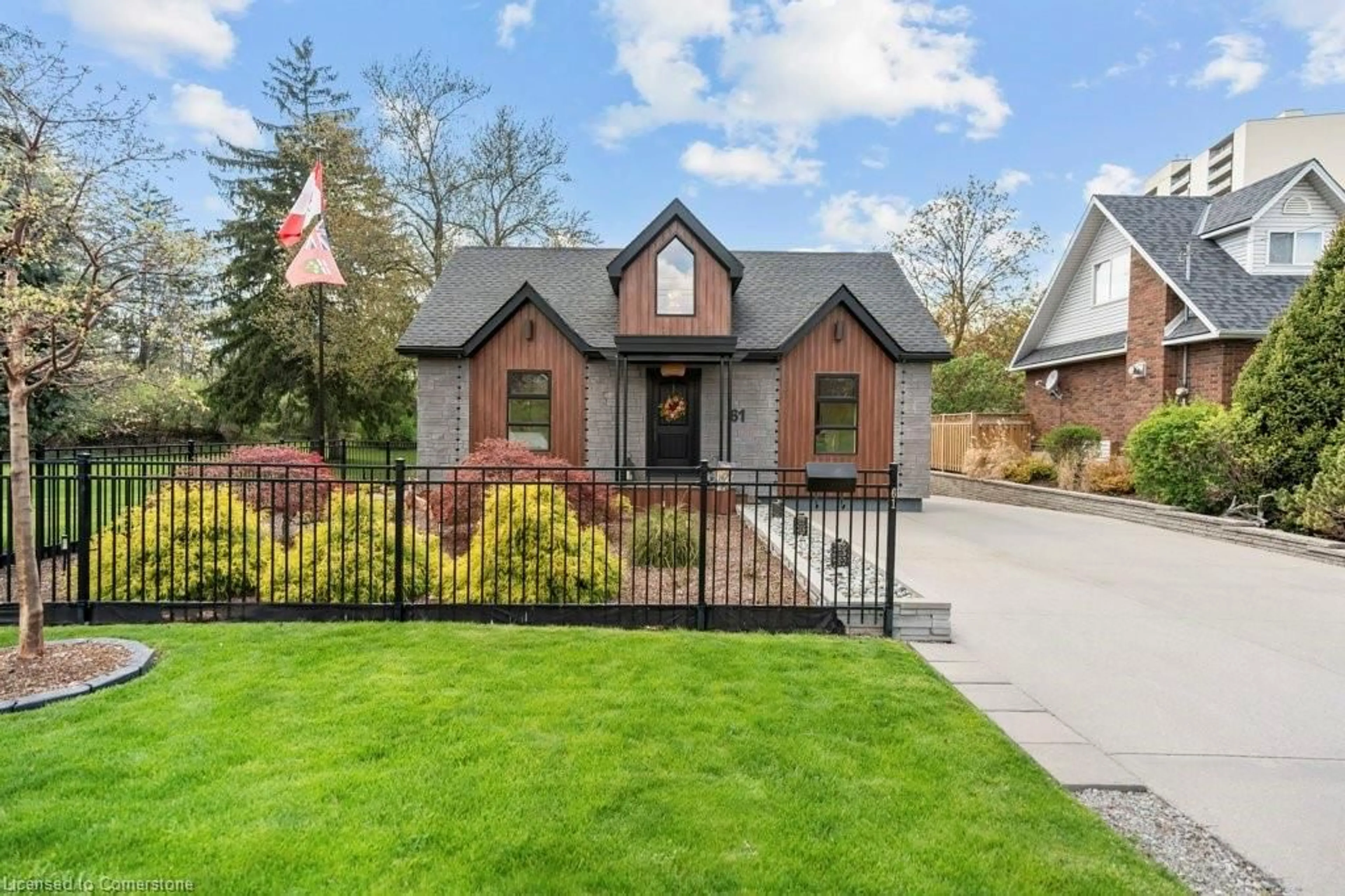 Home with brick exterior material, street for 61 Lake Ave, Hamilton Ontario L8E 1L2