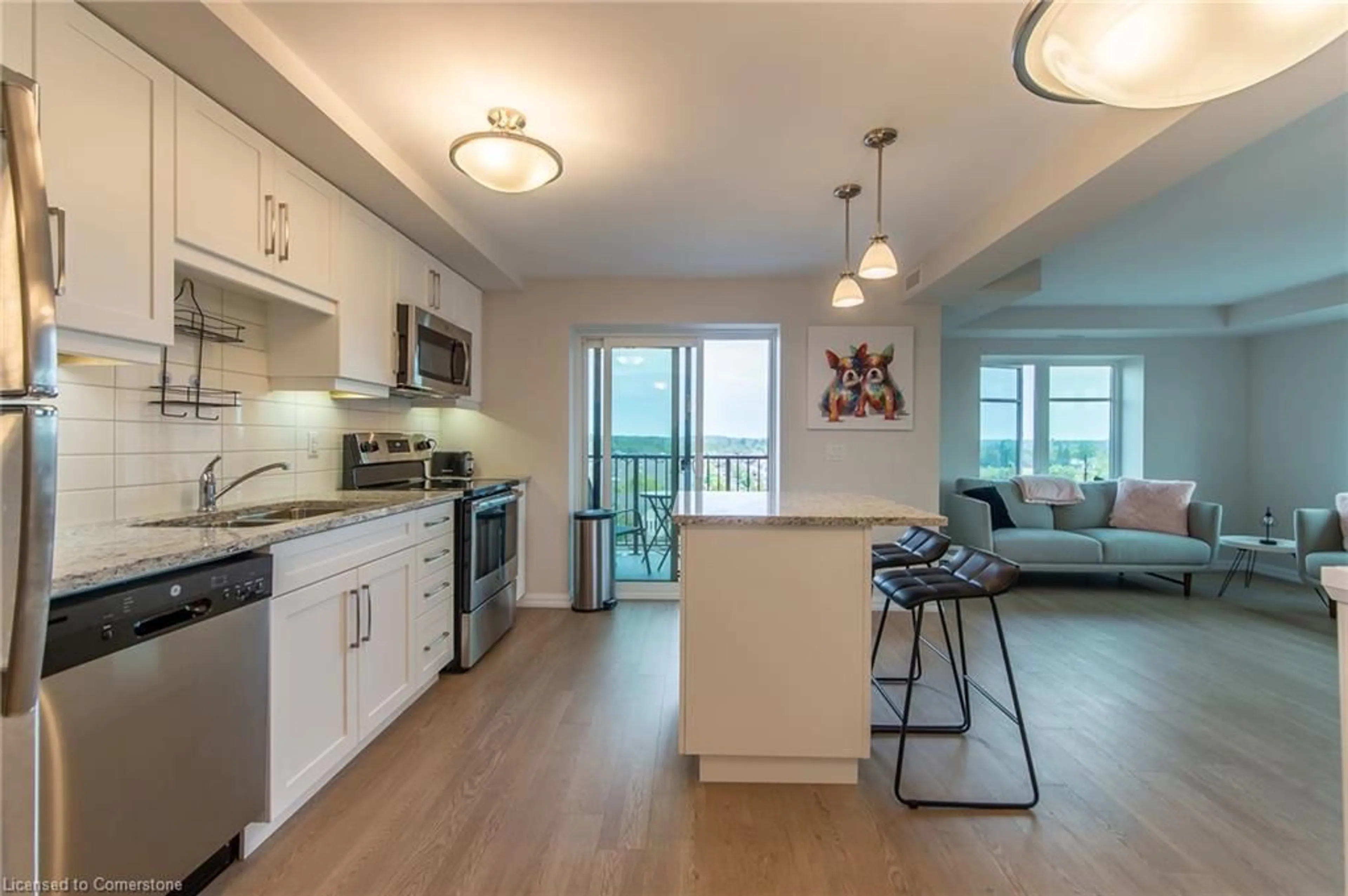 Open concept kitchen, wood/laminate floor for 778 Laurelwood Dr #502, Waterloo Ontario N2V 0A8