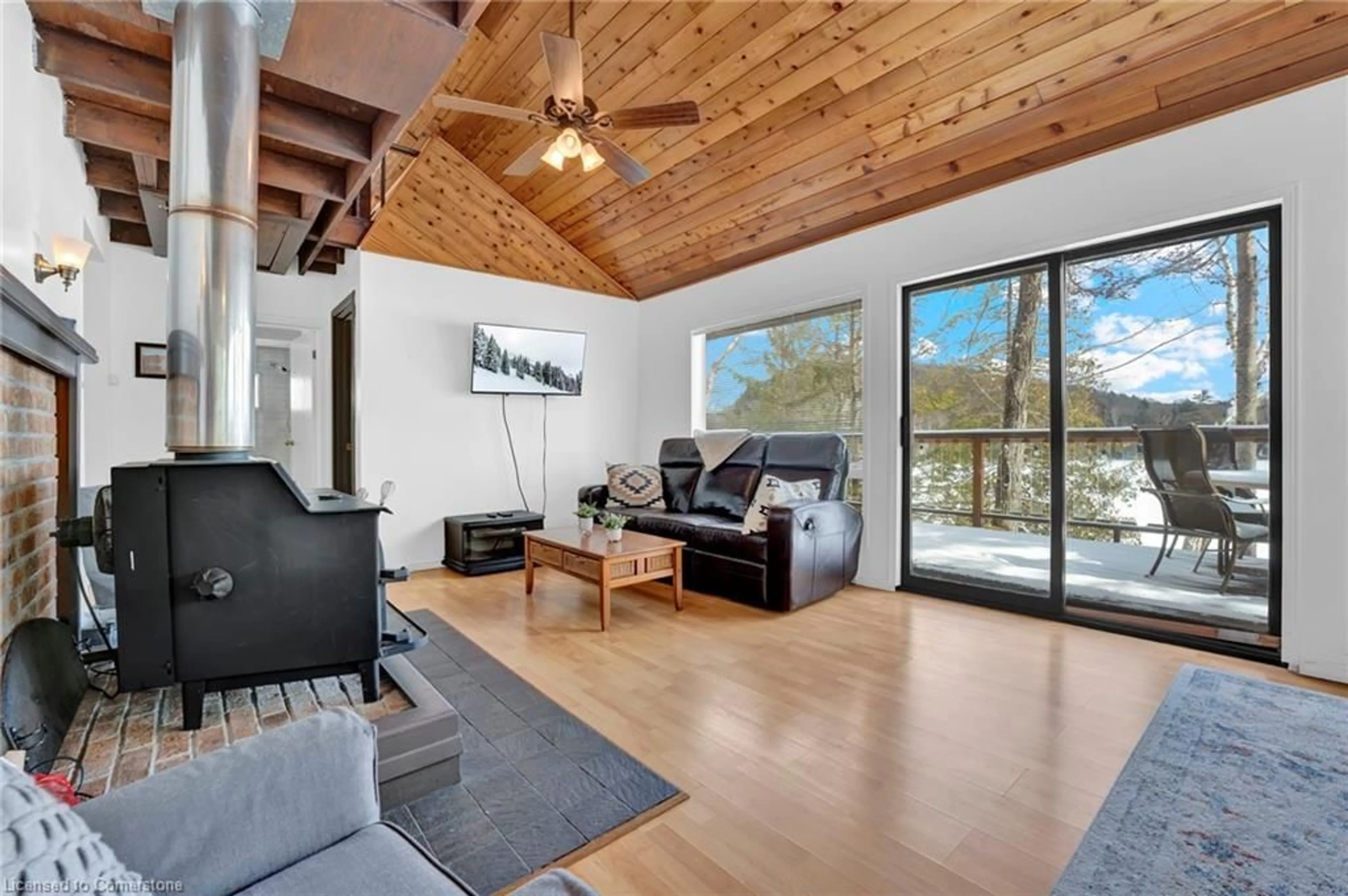 Living room with furniture, wood/laminate floor for 1220 Portage Lake Rd, Dysart Ontario K0M 1S0