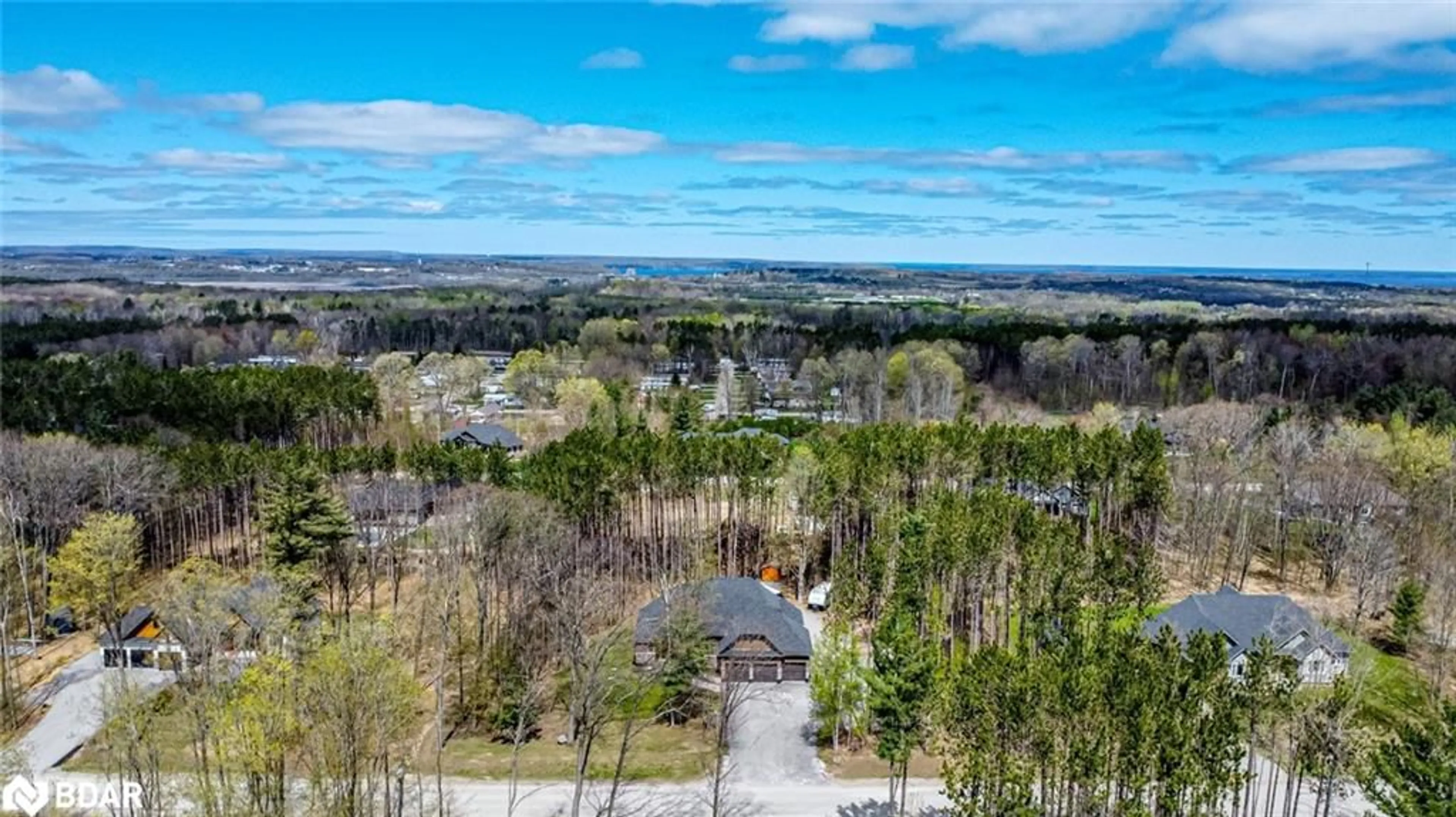 A pic from outside/outdoor area/front of a property/back of a property/a pic from drone, forest/trees view for 38 Windermere Cir, Tay Ontario L4R 0C3