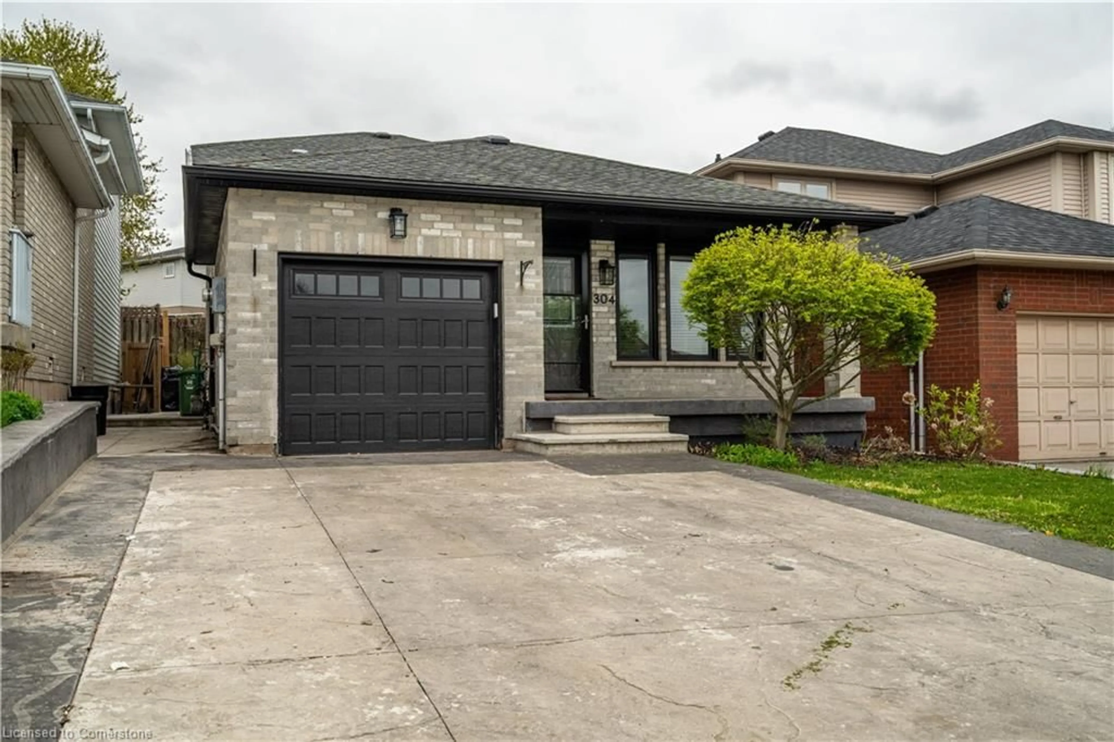 Home with brick exterior material, street for 304 Acadia Dr, Hamilton Ontario L8W 3L1