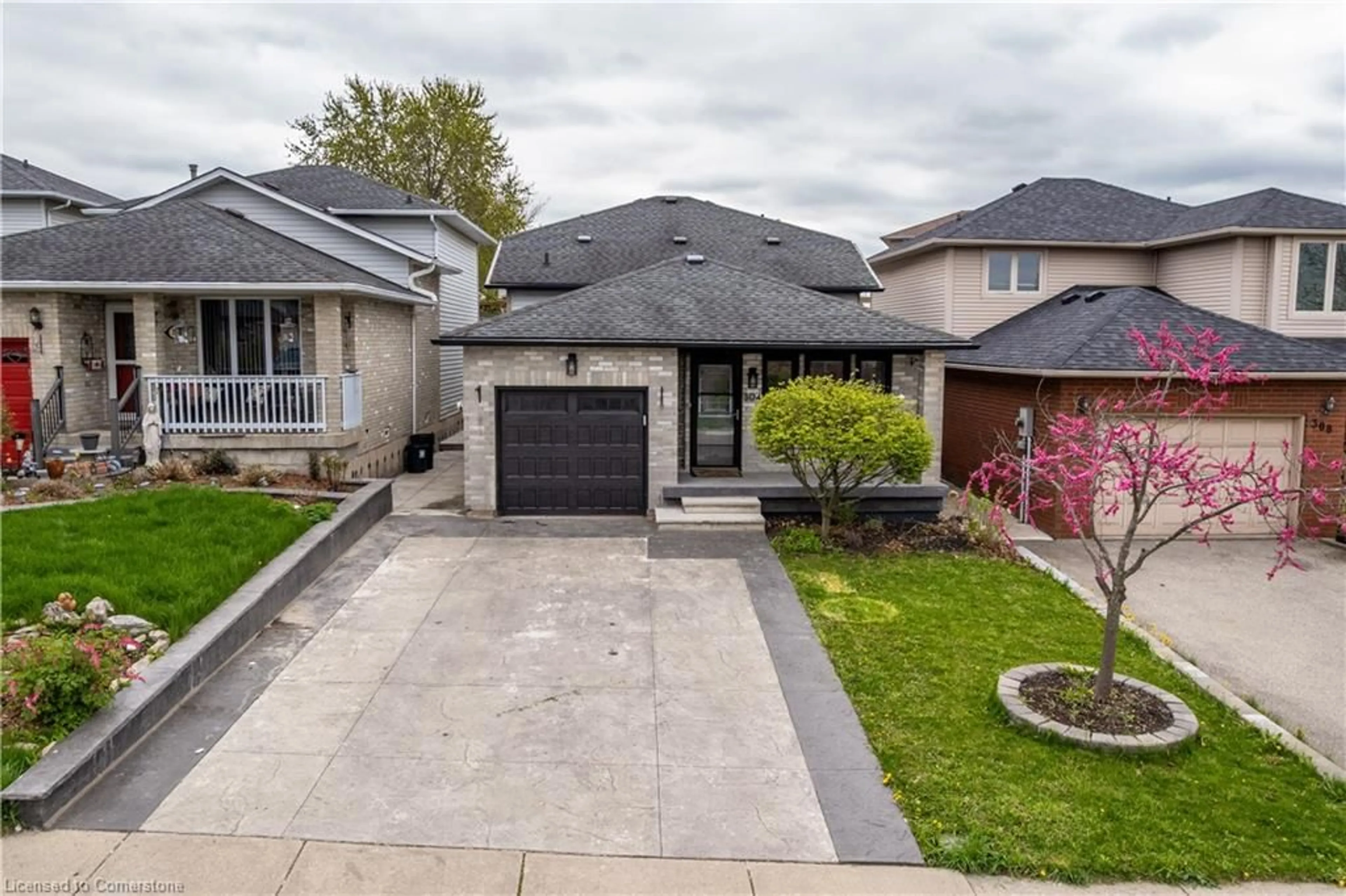 Home with brick exterior material, street for 304 Acadia Dr, Hamilton Ontario L8W 3L1