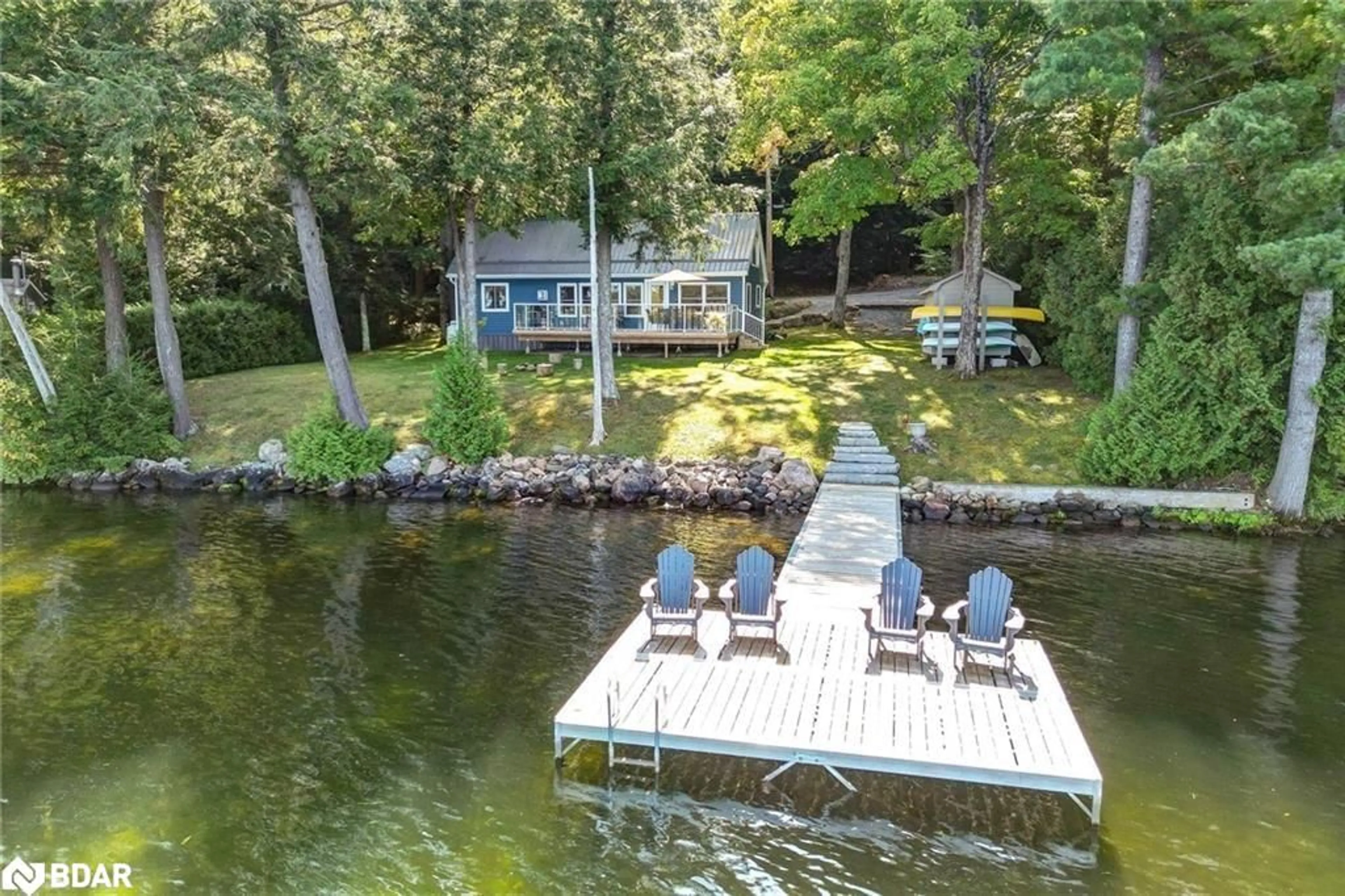 A pic from outside/outdoor area/front of a property/back of a property/a pic from drone, water/lake/river/ocean view for 3158 Spring Lane, Lakefield Ontario K0L 2H0