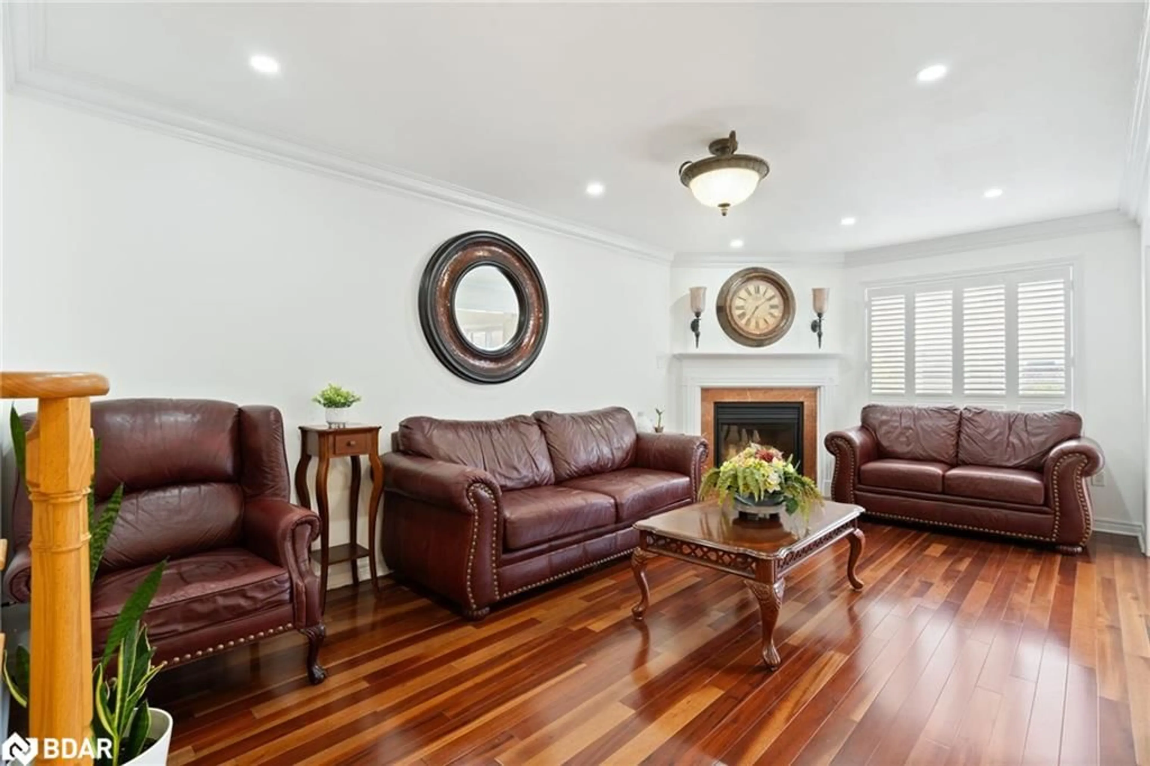 Living room with furniture, wood/laminate floor for 43 Humbershed Cres, Bolton Ontario L7E 2X3