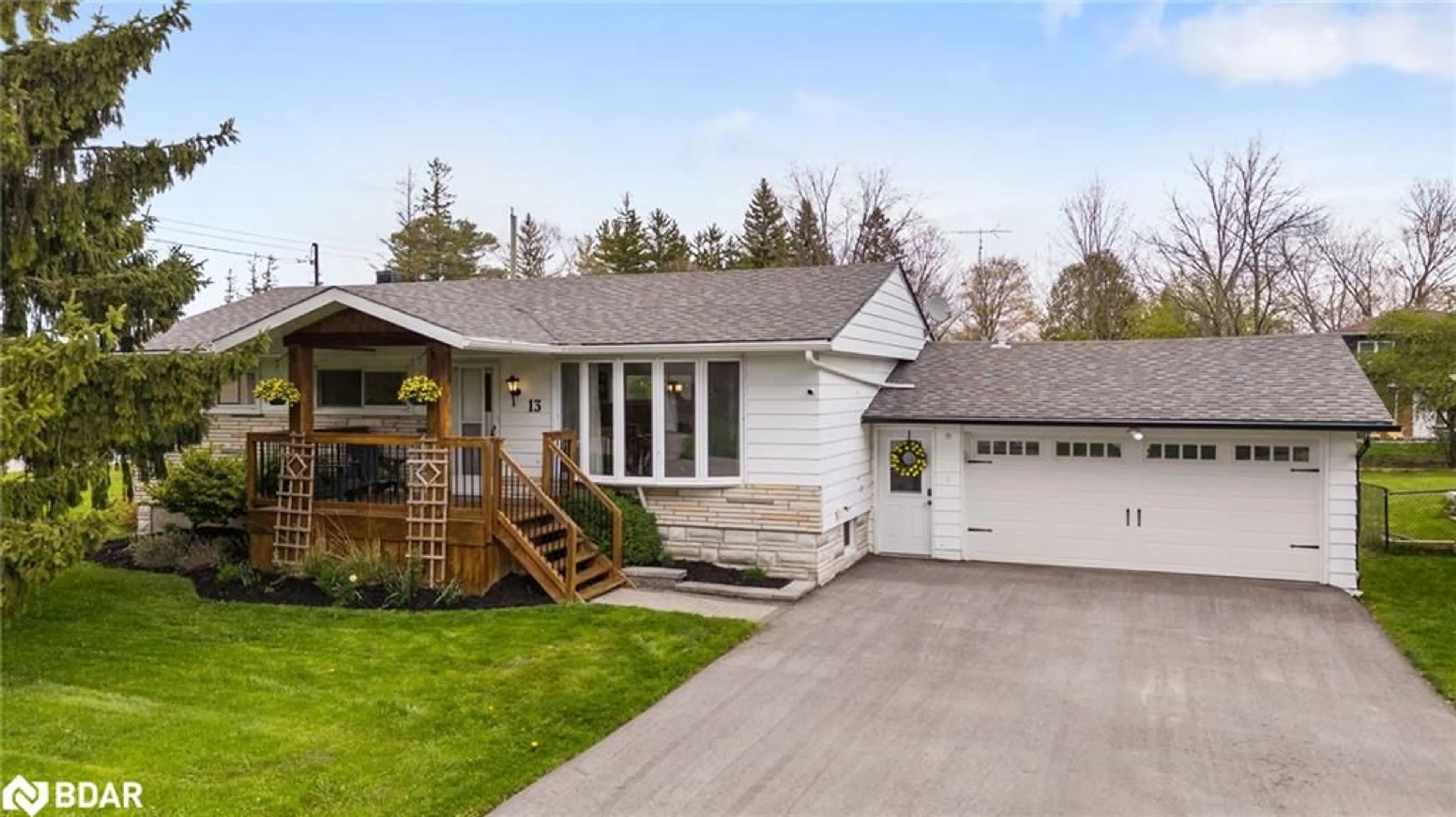 Home with vinyl exterior material, street for 13 Huron St, Springwater Ontario L0L 1Y0