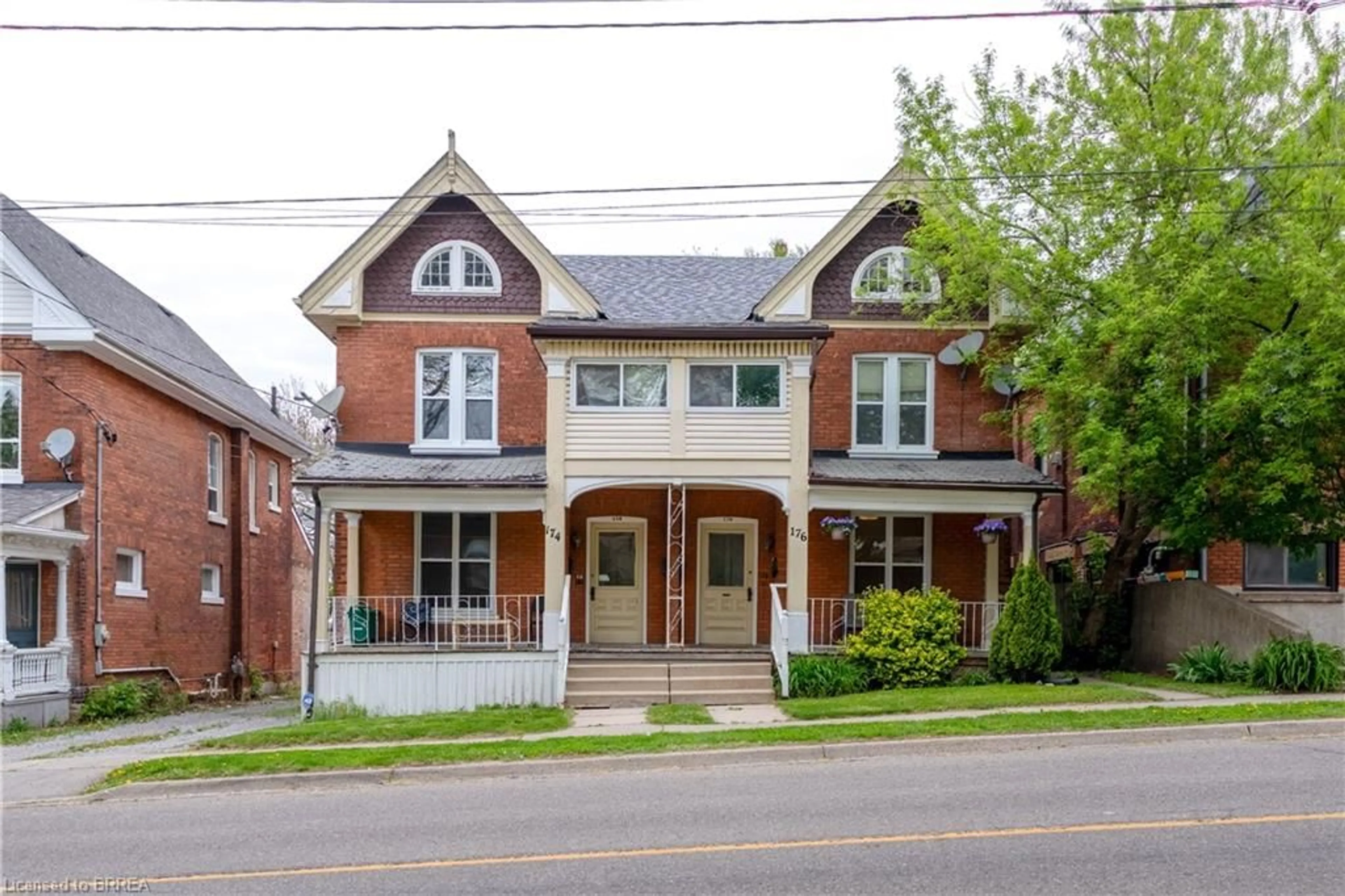 Home with brick exterior material, street for 174-176 Darling St, Brantford Ontario N3S 3W6