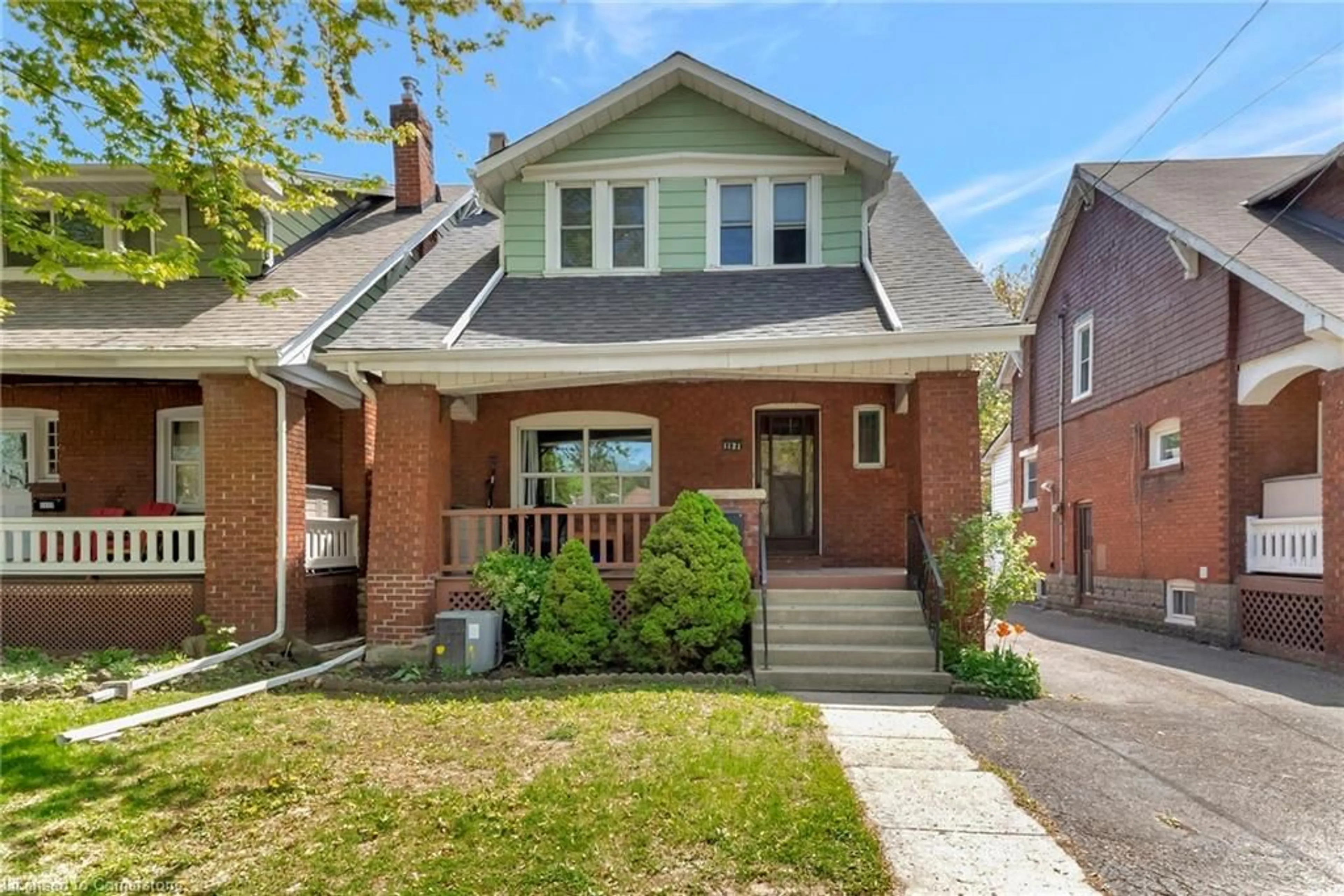Home with brick exterior material, street for 1121 King St, Hamilton Ontario L8S 1L8