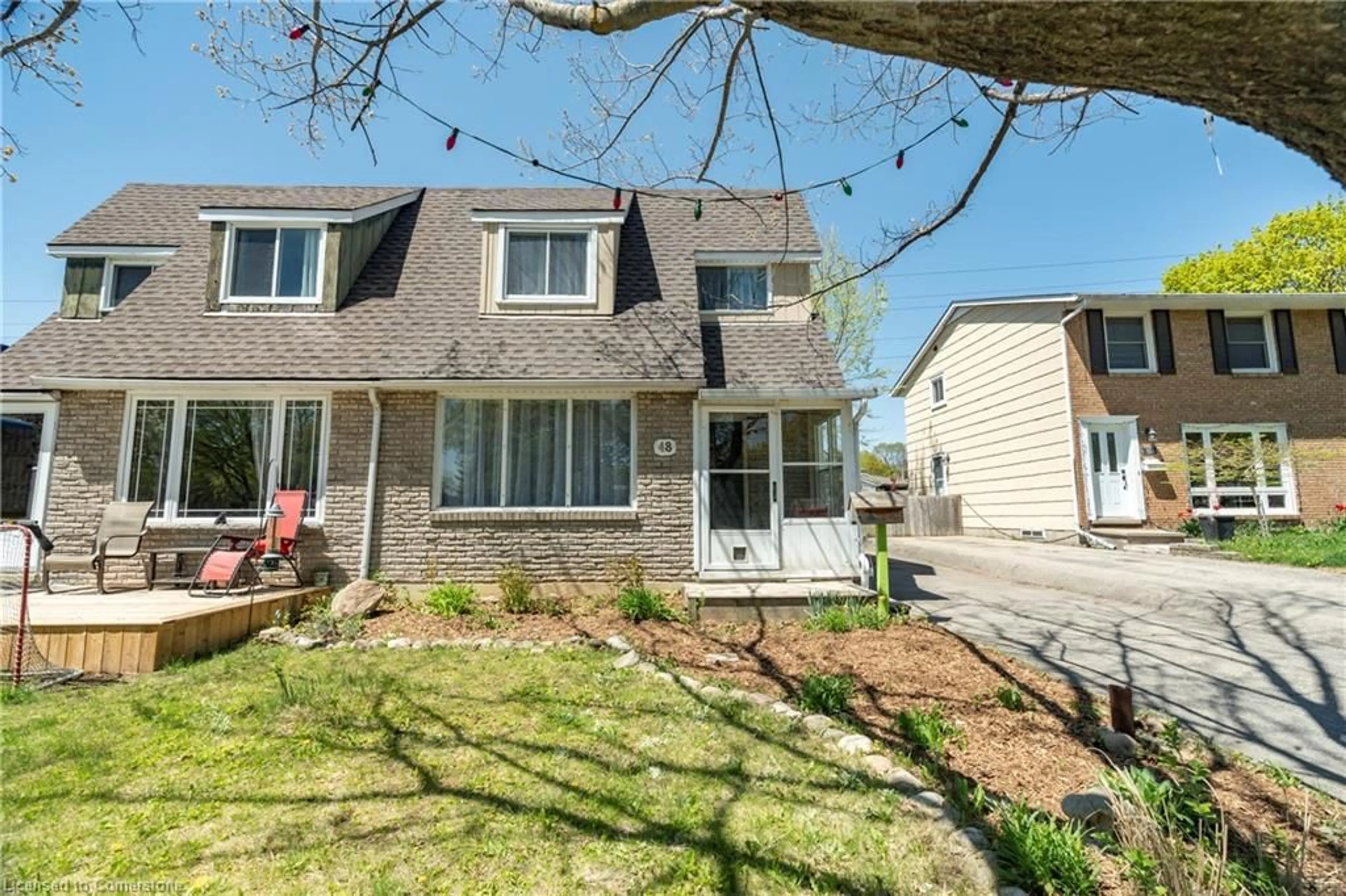 Home with vinyl exterior material, street for 48 Pepperwood Cres, Kitchener Ontario N2A 2R3