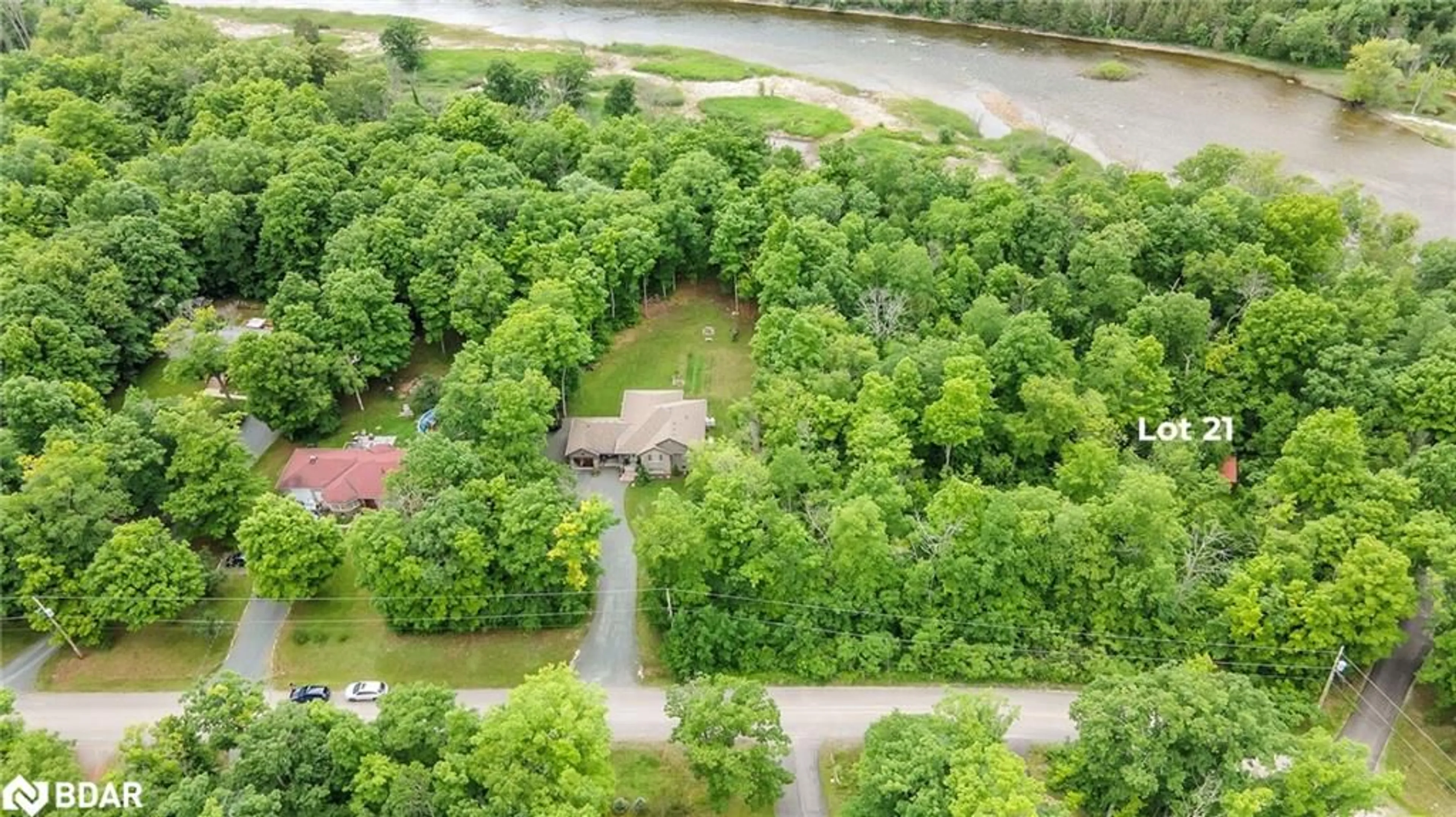 A pic from outside/outdoor area/front of a property/back of a property/a pic from drone, water/lake/river/ocean view for 21 Riverside Drive Dr, Campbellford Ontario K0K 1L0