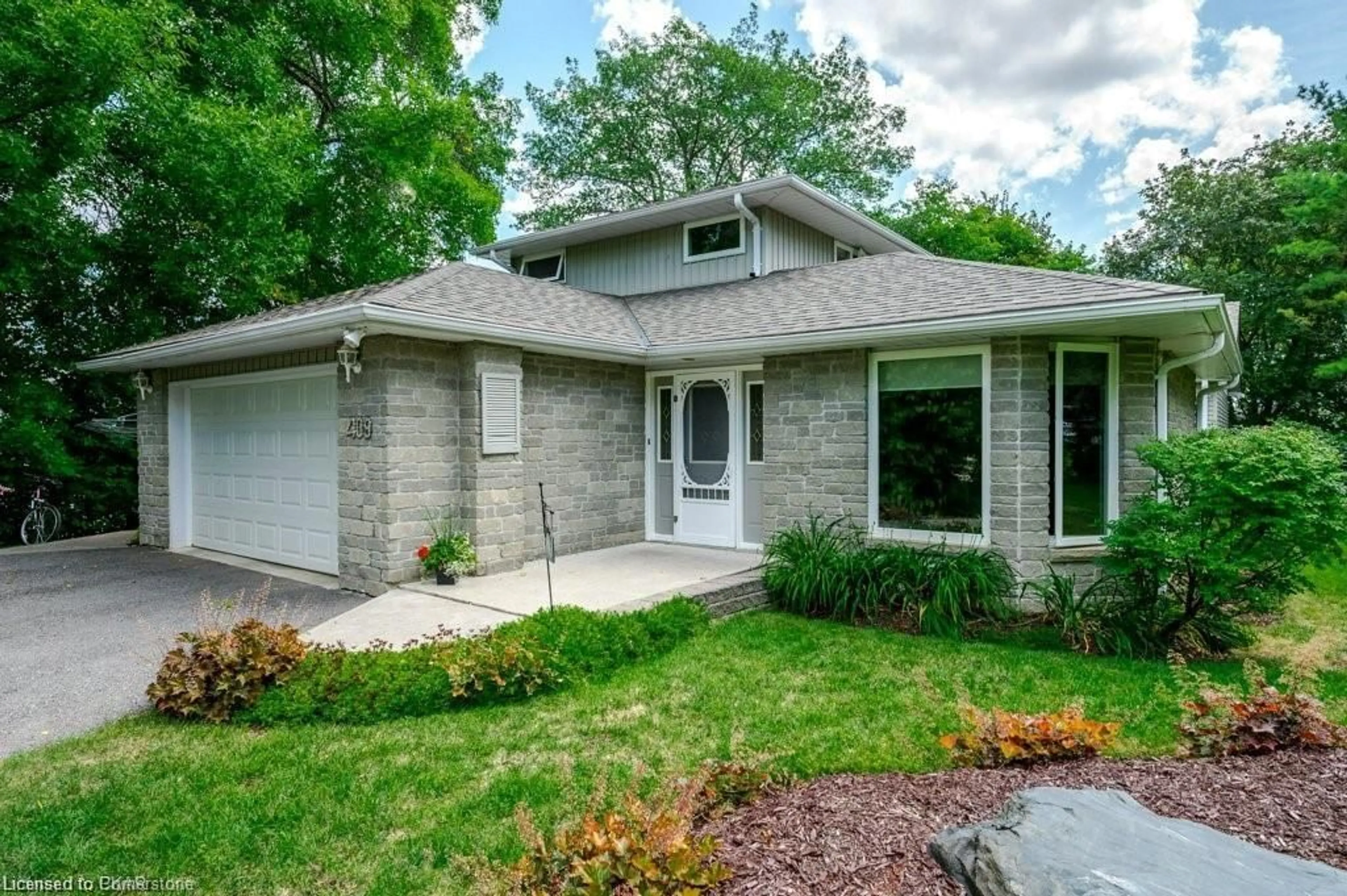 Home with brick exterior material, street for 409 Gifford Dr, Ennismore Township Ontario K0L 1T0