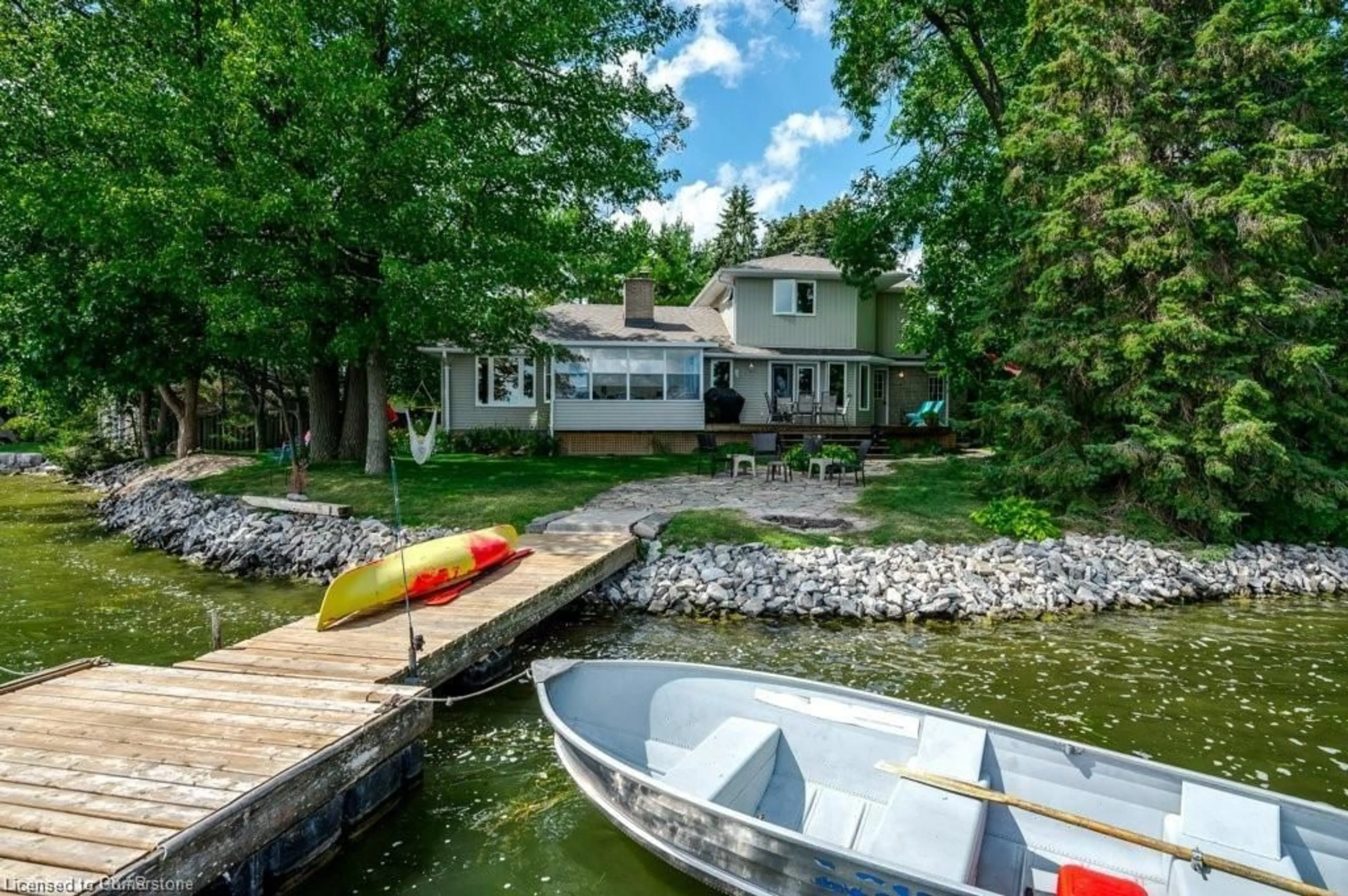 A pic from outside/outdoor area/front of a property/back of a property/a pic from drone, water/lake/river/ocean view for 409 Gifford Dr, Ennismore Township Ontario K0L 1T0