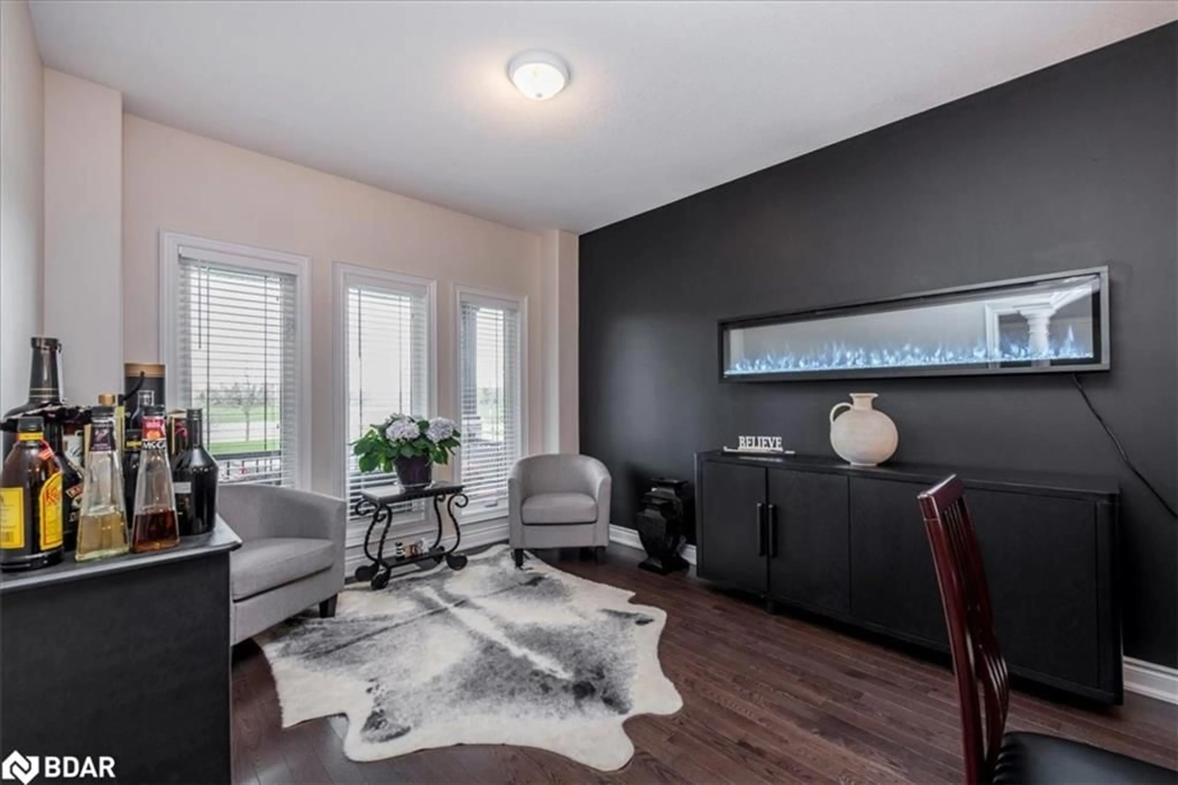 Living room with furniture, wood/laminate floor for 1171 Quarry Drive Dr, Innisfil Ontario L9S 4W8