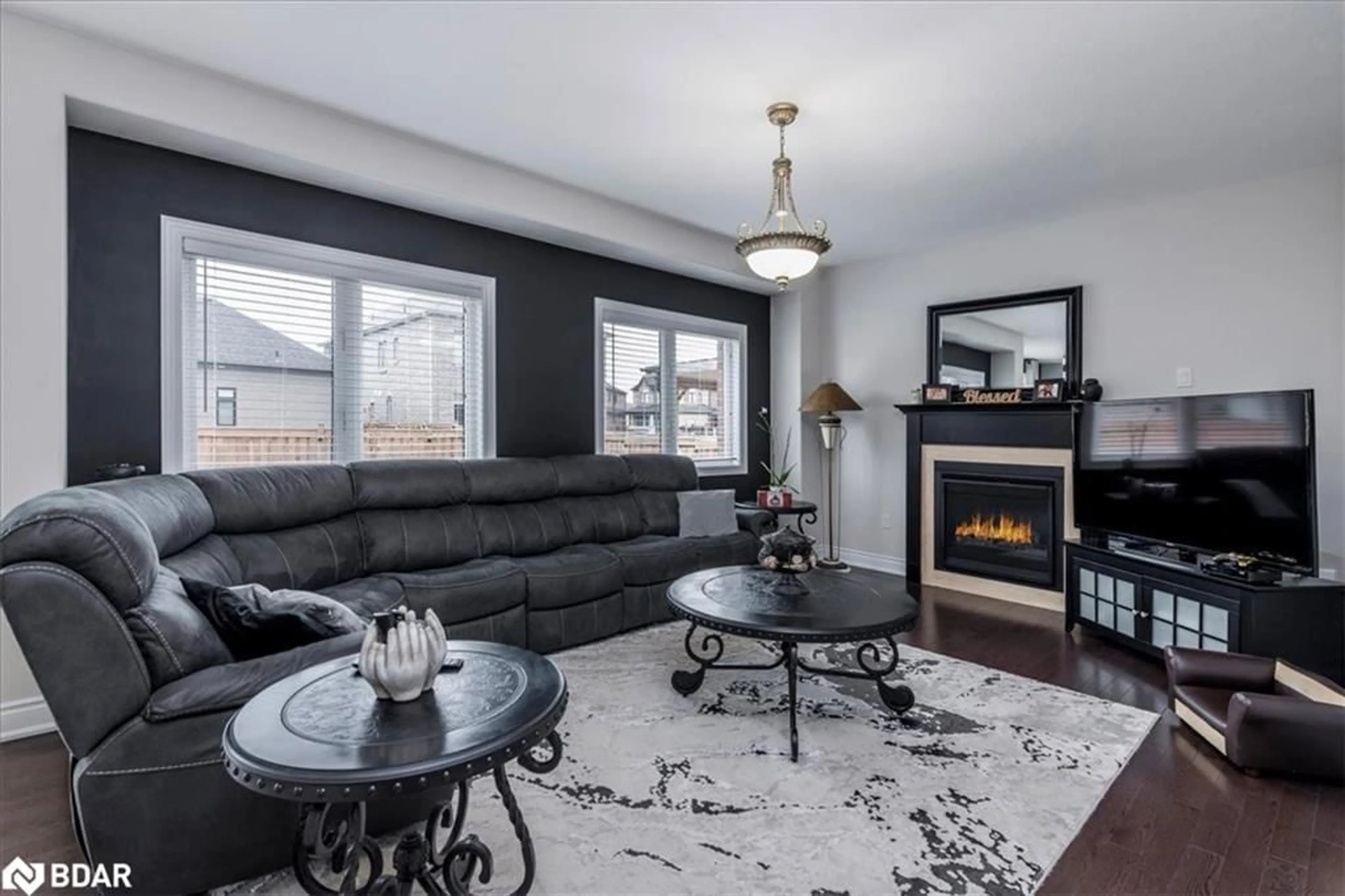 Living room with furniture, wood/laminate floor for 1171 Quarry Drive Dr, Innisfil Ontario L9S 4W8