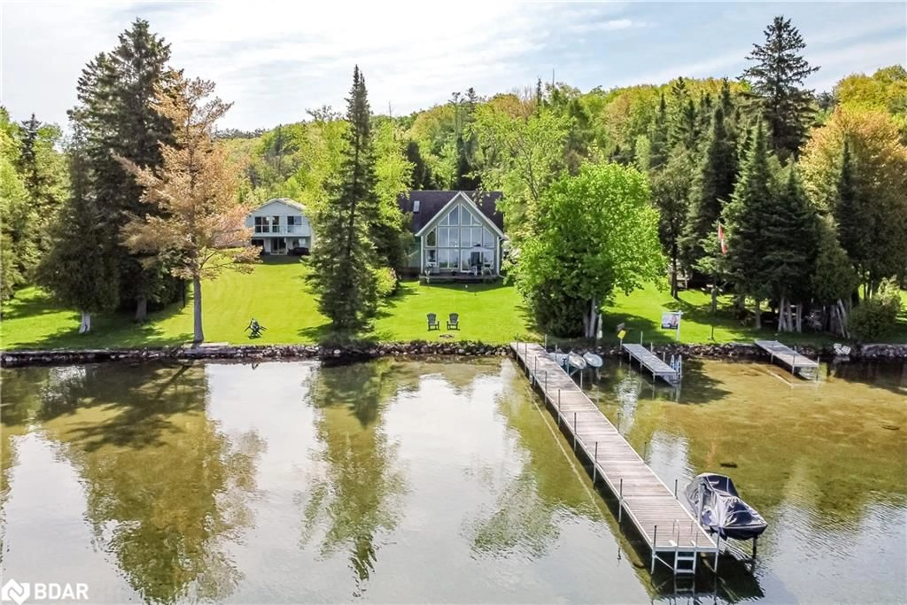A pic from outside/outdoor area/front of a property/back of a property/a pic from drone, water/lake/river/ocean view for 10 Buttercup Lane Lane, Orr Lake Ontario L0L 1P0