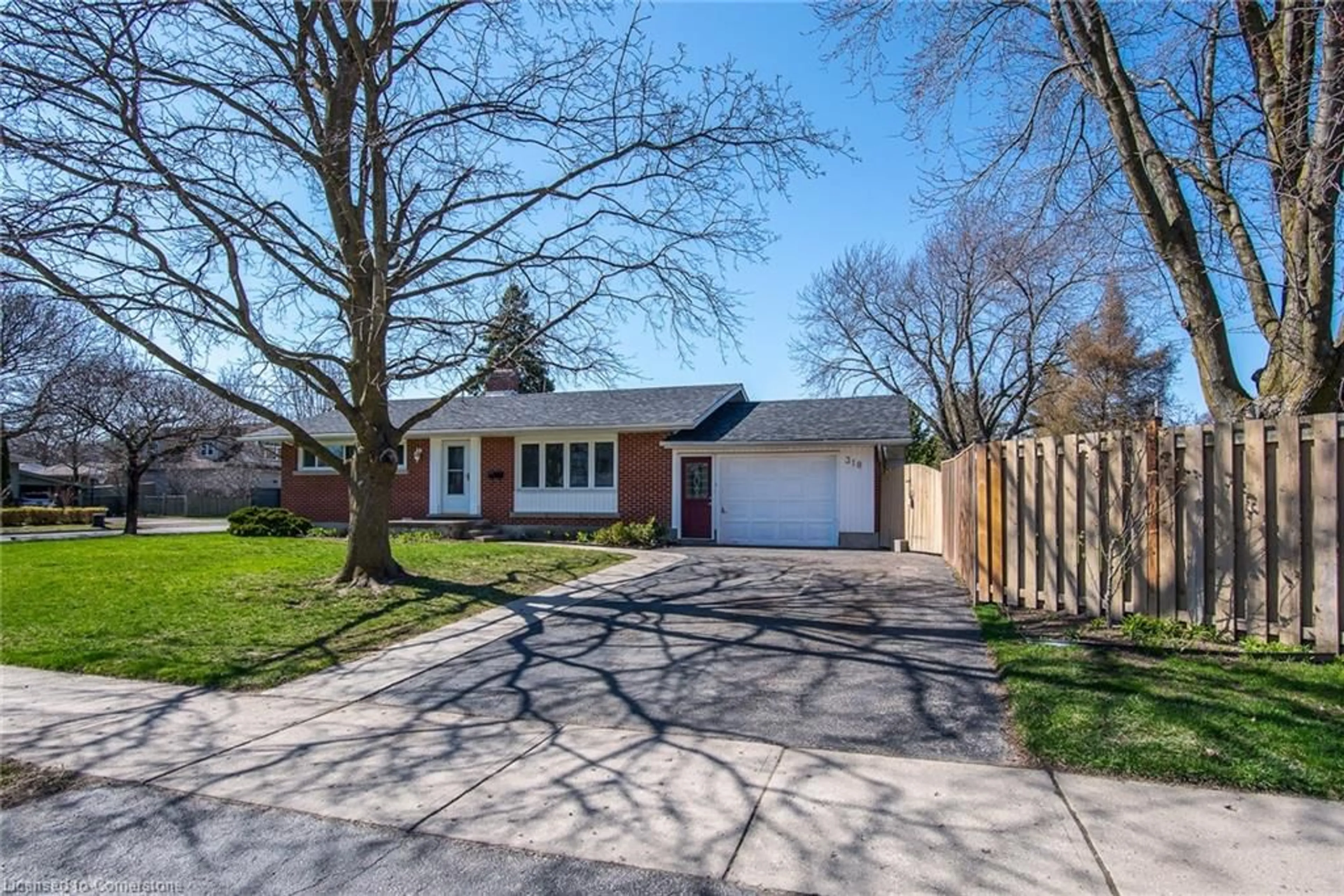 Home with brick exterior material, street for 318 Greenbrook Dr, Kitchener Ontario N2M 4K3