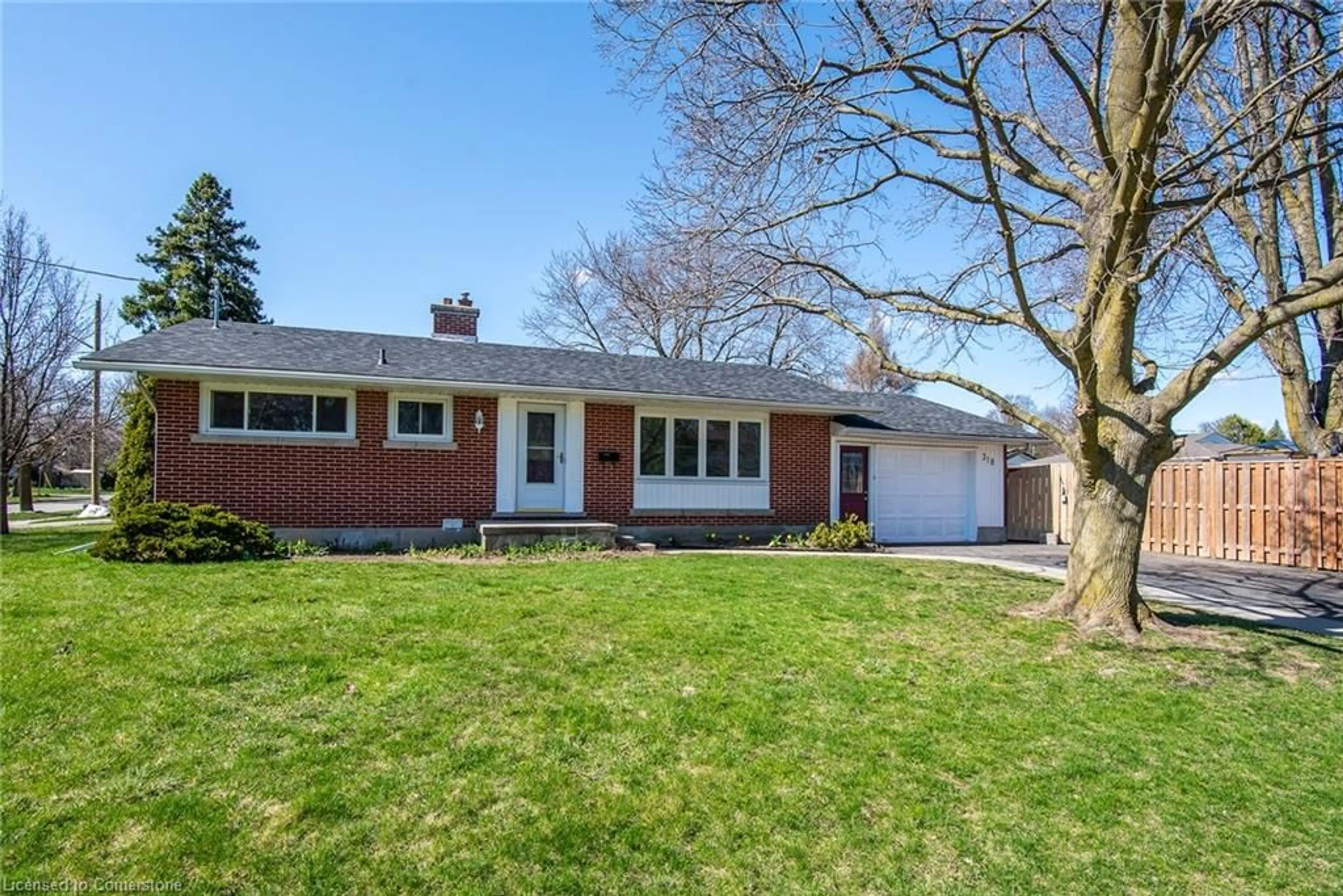 Home with brick exterior material, street for 318 Greenbrook Dr, Kitchener Ontario N2M 4K3
